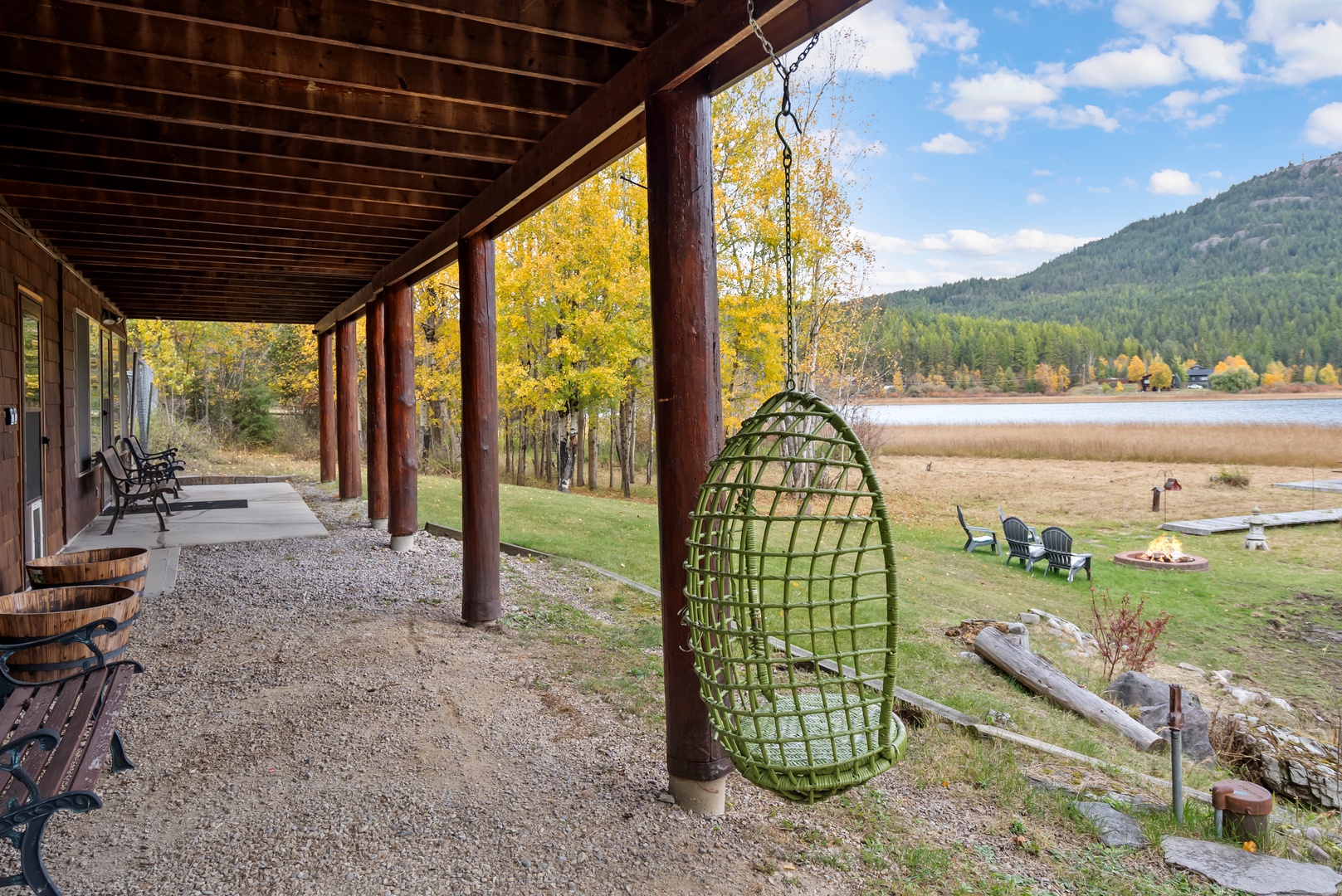 Relax in your private hanging chair on this covered porch, overlooking autumn trees and peaceful lake views.