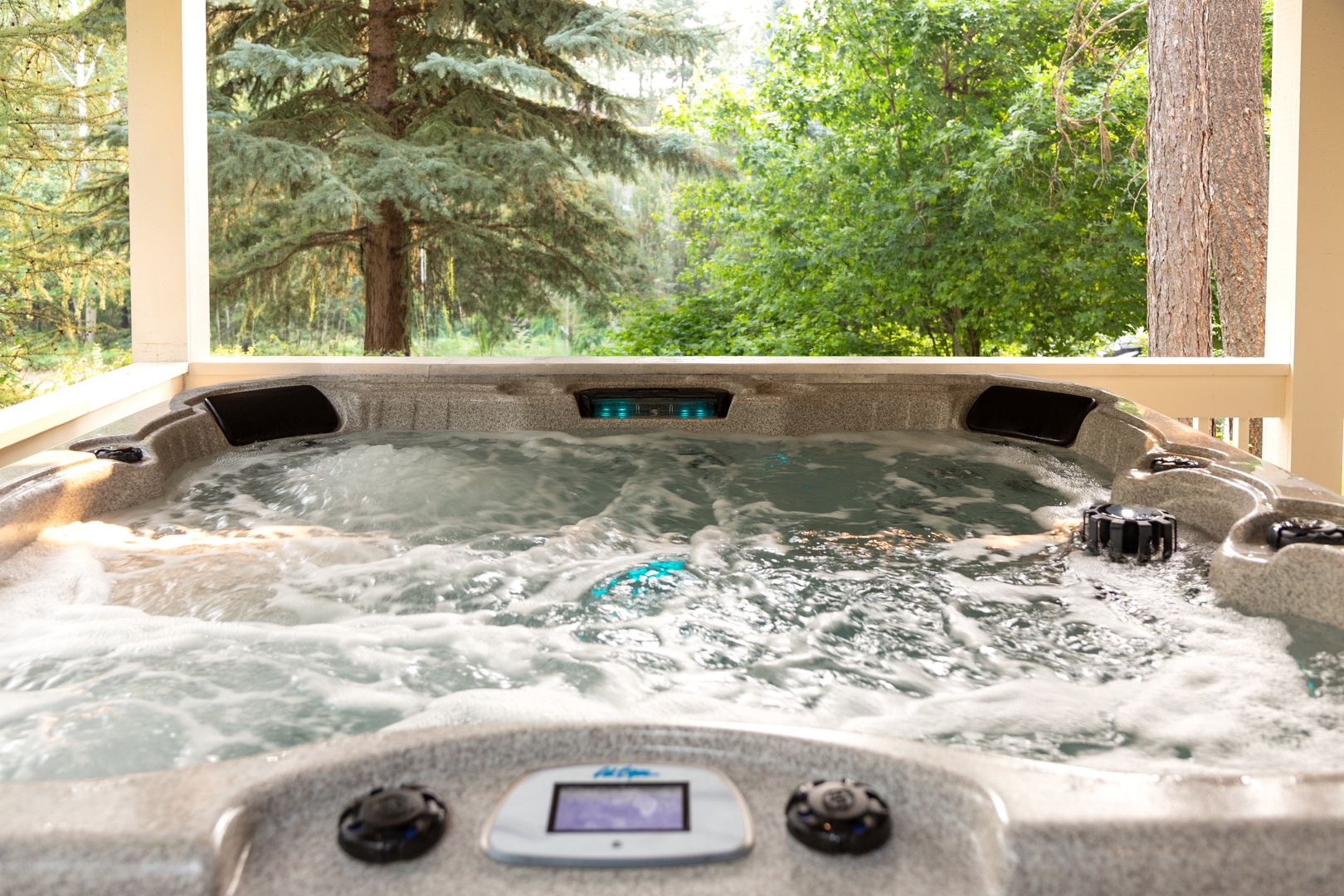 Slip into your private hot tub and let the therapeutic jets melt away your cares while you gaze out at the serene forest just beyond the deck.