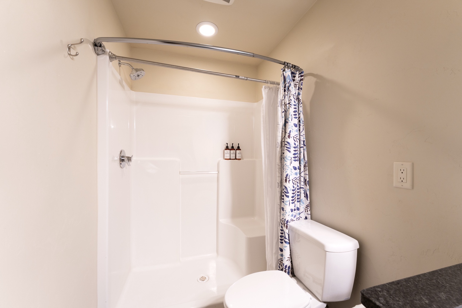 Your private bathroom features a spacious walk-in shower with fresh towels and quality toiletries waiting for you. The clean, modern design ensures comfort after a long day exploring.