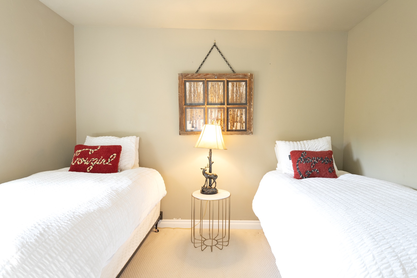 Sink into crisp white linens after a day of adventure. This cozy twin bedroom offers flexible sleeping arrangements with rustic charm and thoughtful touches, perfect for friends or family traveling together.