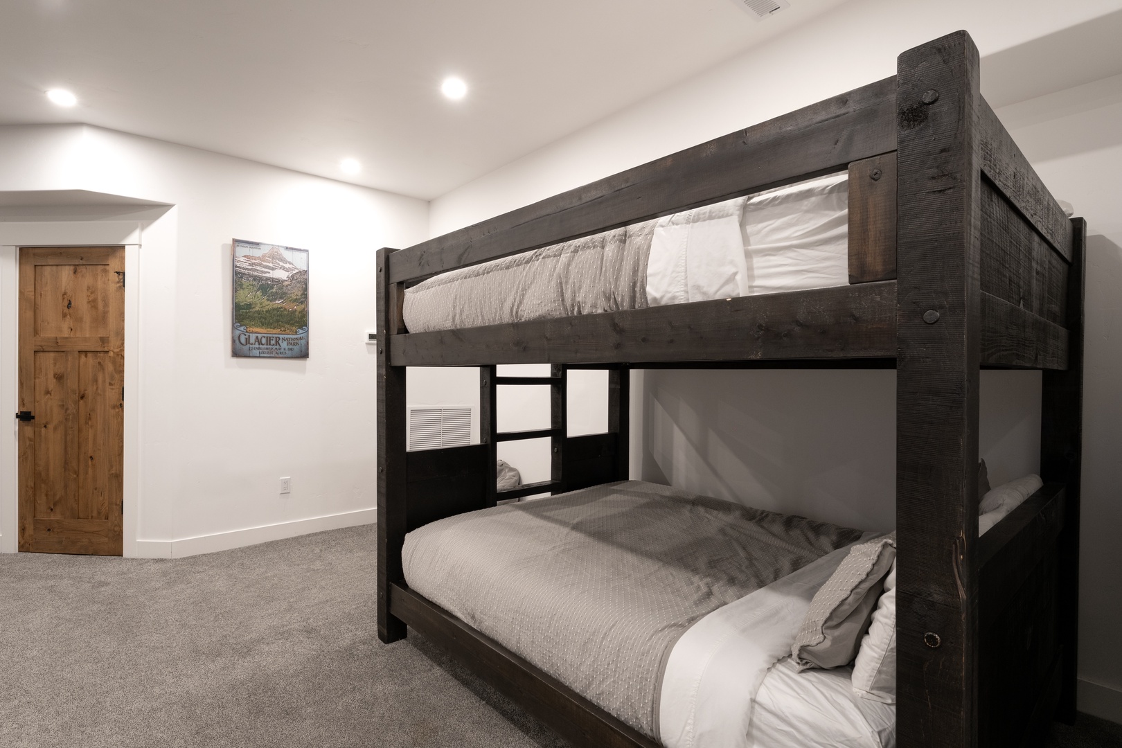 Your cozy bunk bed room features rustic wood frames and fresh linens for restful nights.