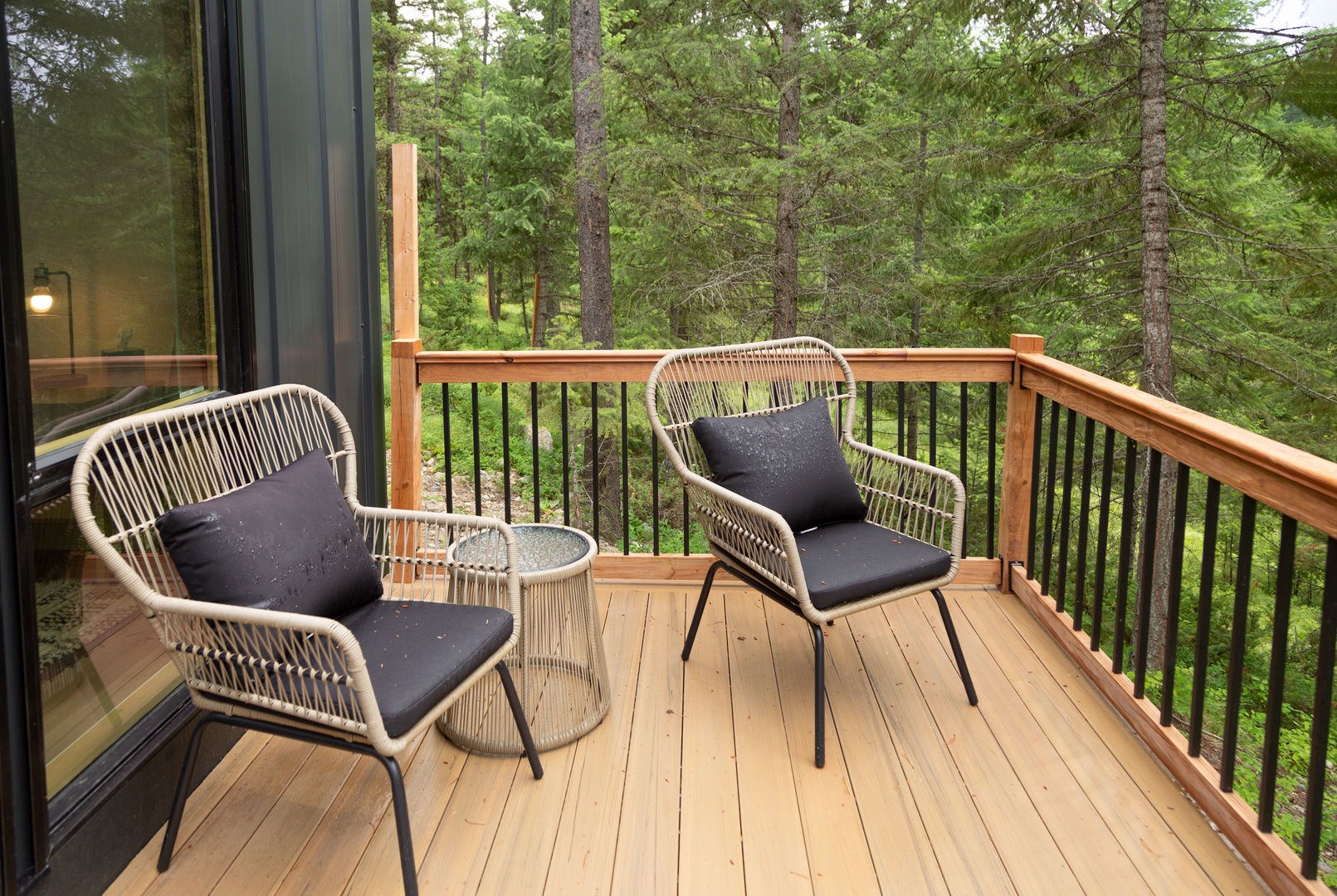 Step onto your private balcony and breathe in the fresh forest air while you relax in comfort surrounded by towering evergreens.