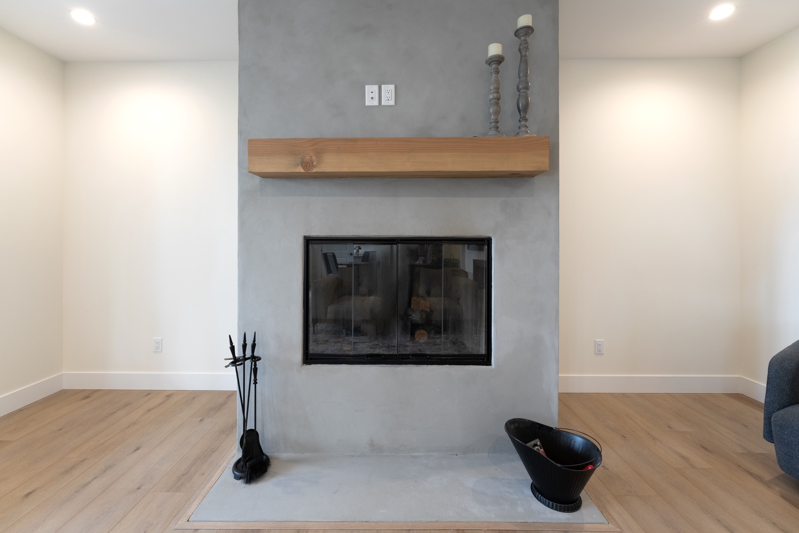 Gather around this sleek modern fireplace, where contemporary design meets cozy warmth. The clean lines and rustic wood mantel create the perfect spot for your evening relaxation.