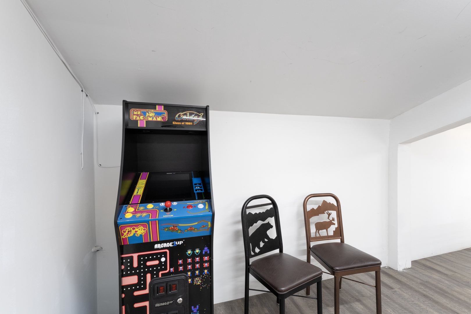Challenge yourselves to a nostalgic game night in your cozy upstairs hideaway, where classic arcade fun meets rustic mountain charm.