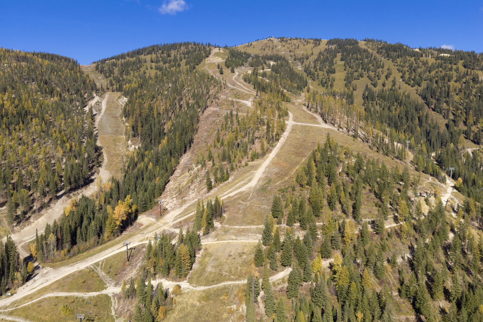 Scenic mountain terrain with forested slopes and trails, part of the property's stunning natural surroundings and outdoor recreational area.