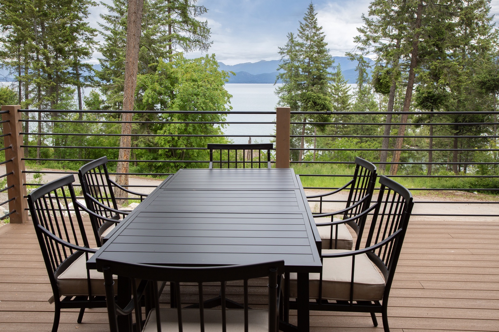 A property nestled in a peaceful mountain and lakeside setting, surrounded by natural forest landscape, offering a serene retreat experience for guests.