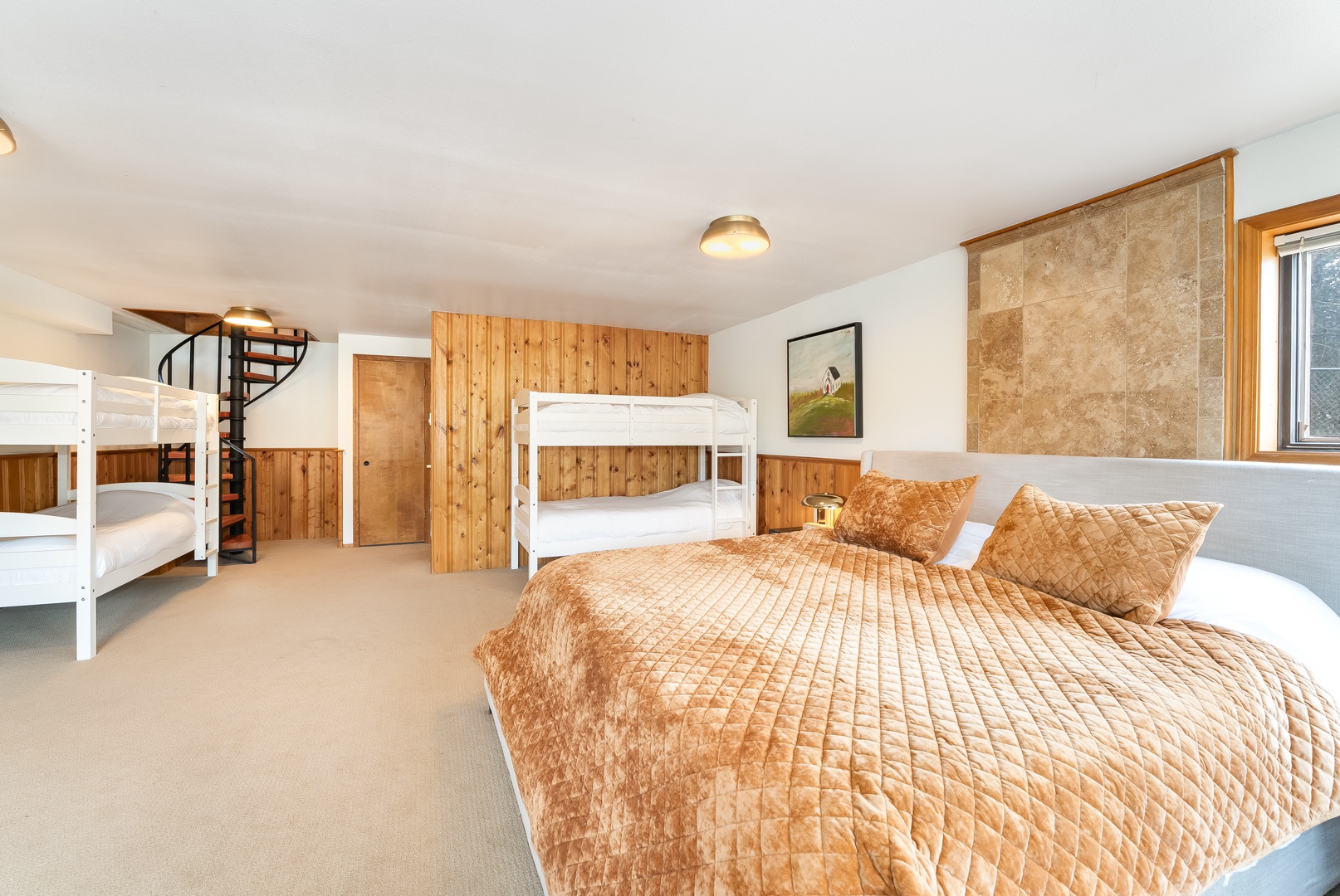 Cozy family bedroom with warm wood tones and comfortable beds for restful nights together.