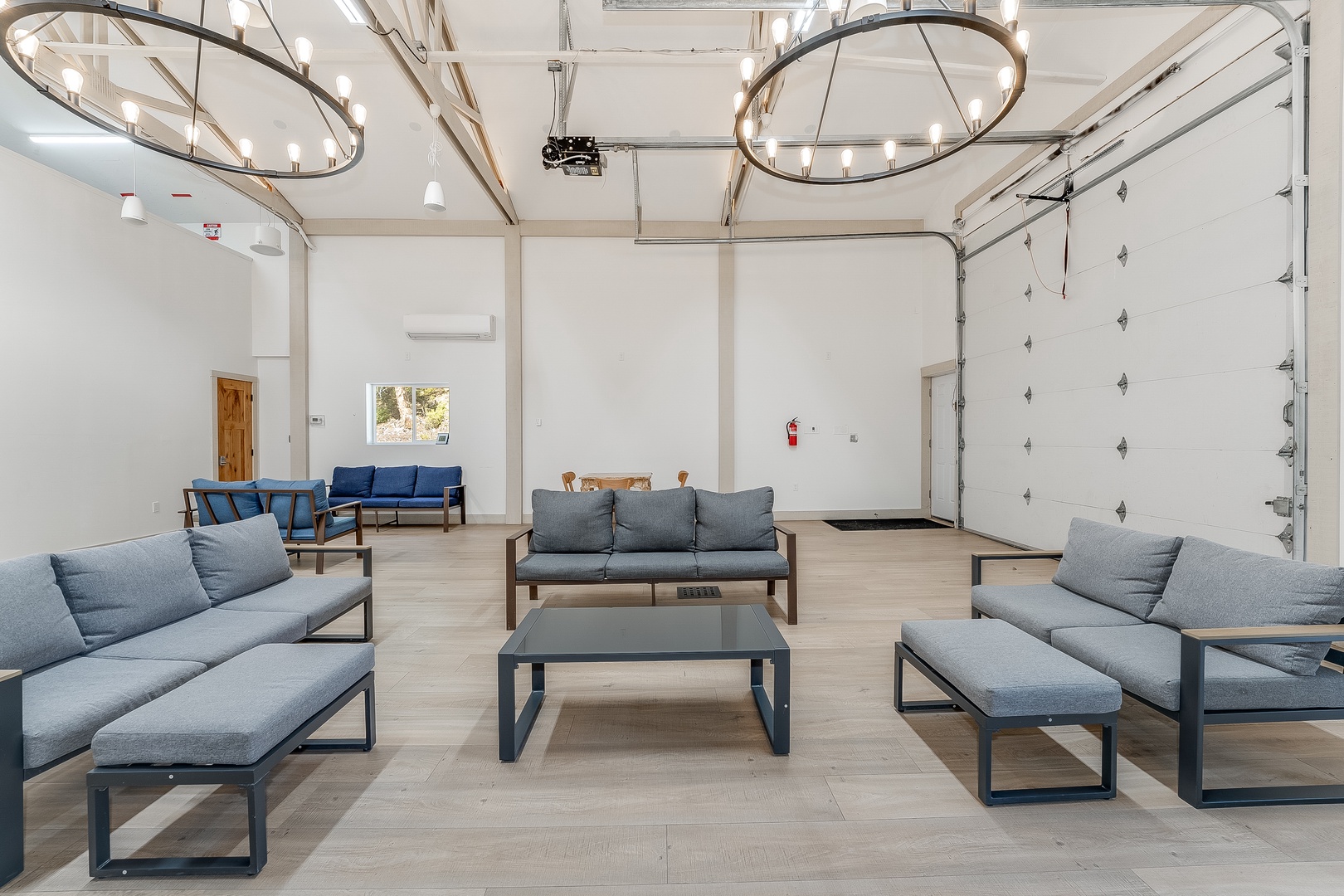 Gather with friends in this stylish shared lounge, where modern furnishings and elegant lighting create the perfect space for your group to relax and connect.
