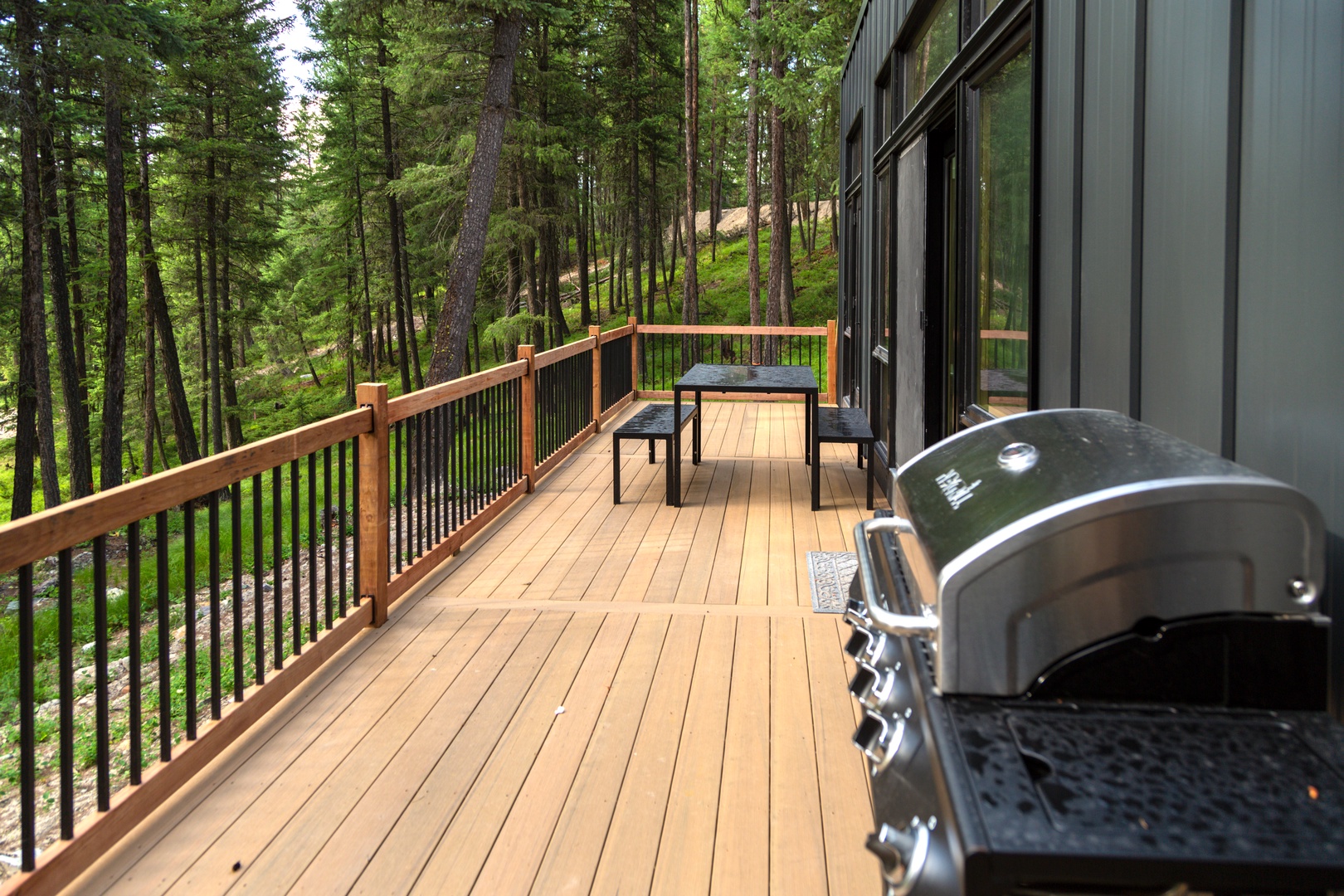 Step onto your private deck surrounded by towering pines, where forest views frame your morning coffee and evening BBQ sessions perfectly.