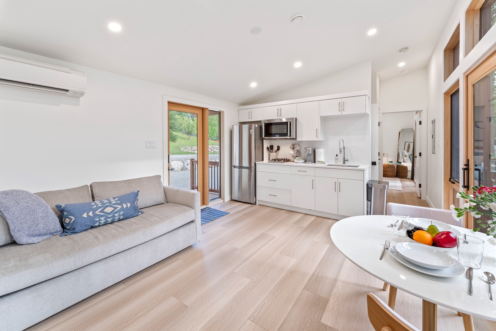 Relax in your bright, modern space where the kitchen flows seamlessly into your cozy living area, complete with garden views.