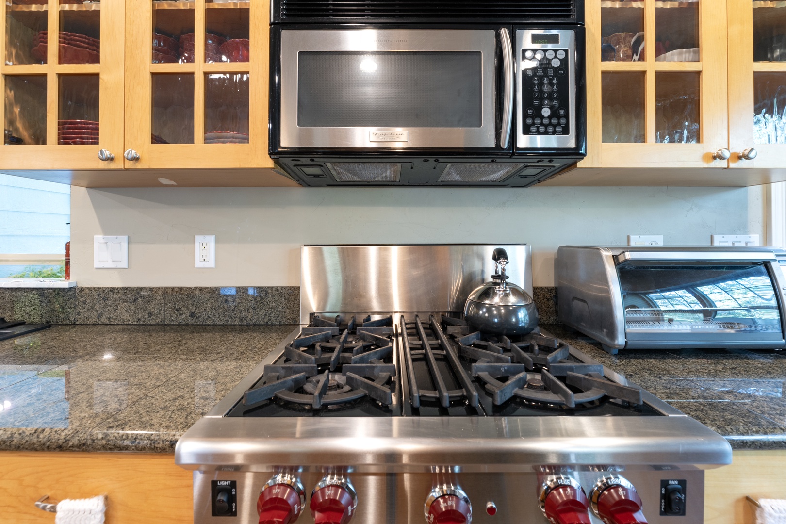 Your fully equipped kitchen features a professional gas range, granite counters, and all the appliances you need to prepare meals at your own pace.
