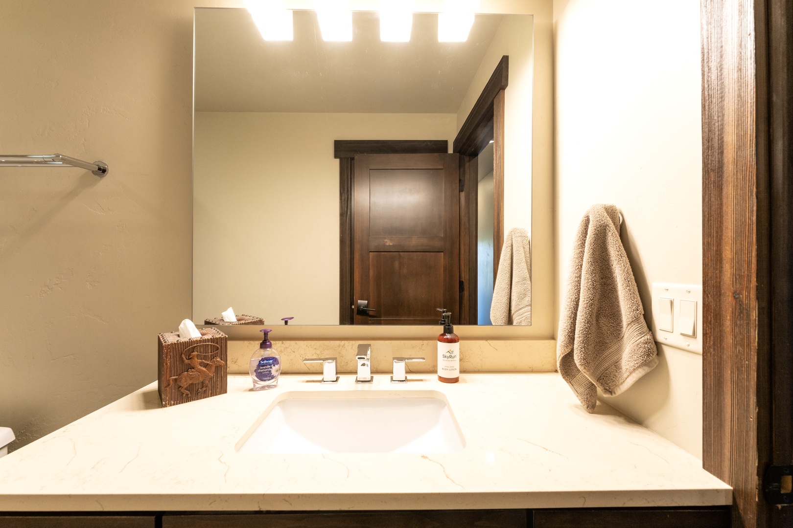 Your private bathroom features a spacious vanity with plush towels and soft lighting to help you unwind after a day of adventure.
