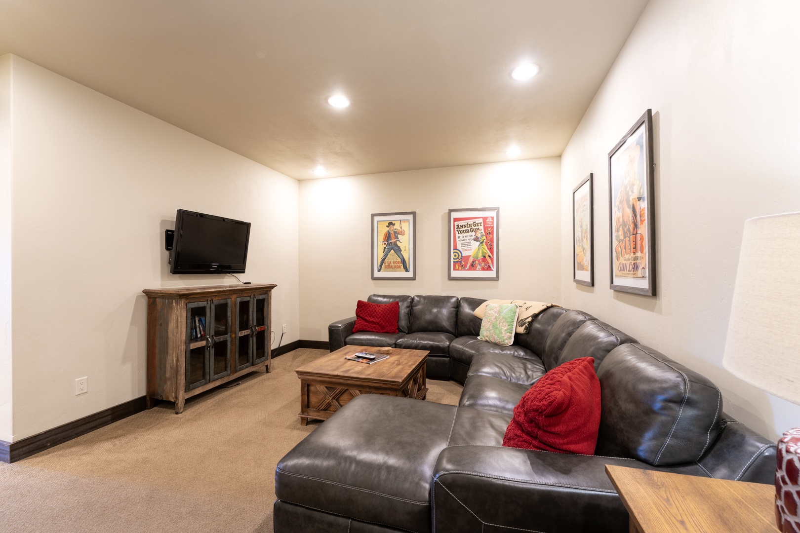 Settle into your private media room with plush leather seating, warm wood accents, and recessed lighting—perfect for movie nights or unwinding after a day of adventure.