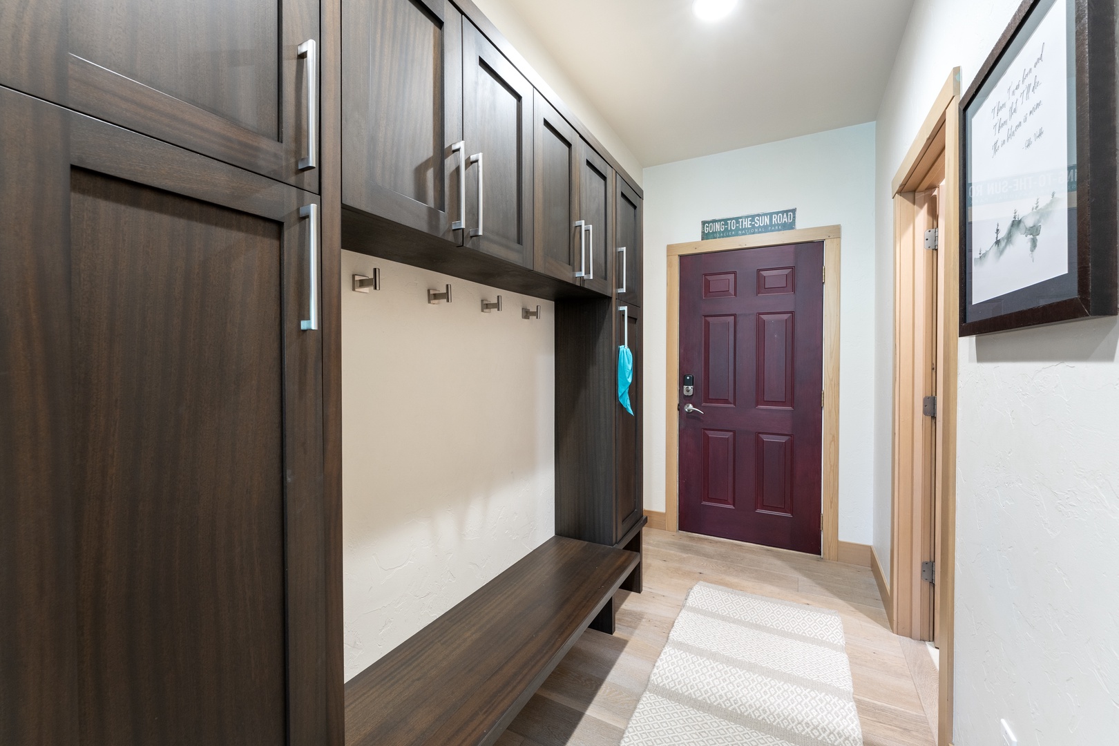 A welcoming entryway with custom built-in storage and convenient hooks to organize your gear after a day of mountain adventures.