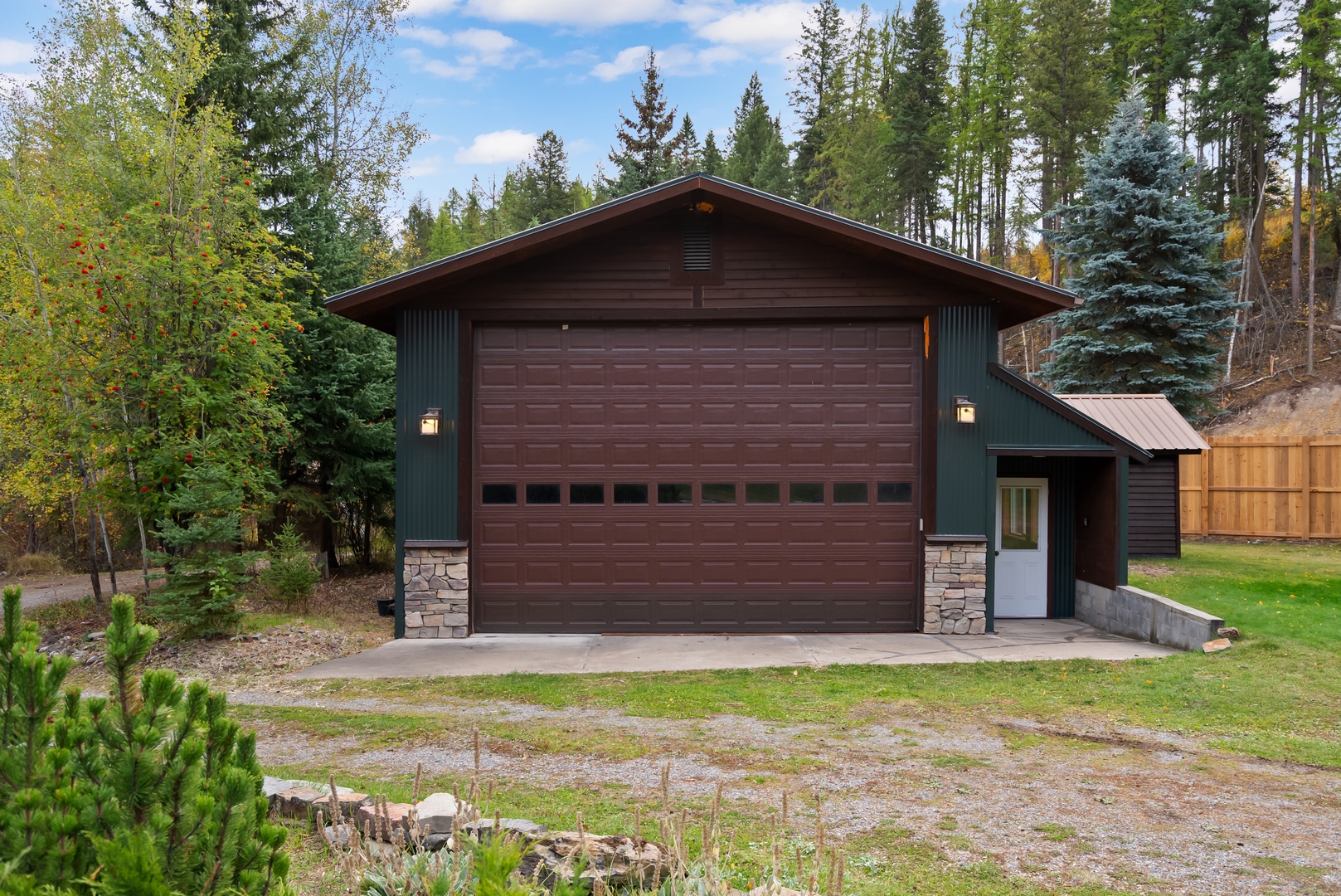 A charming mountain retreat surrounded by towering evergreens and peaceful forest setting.