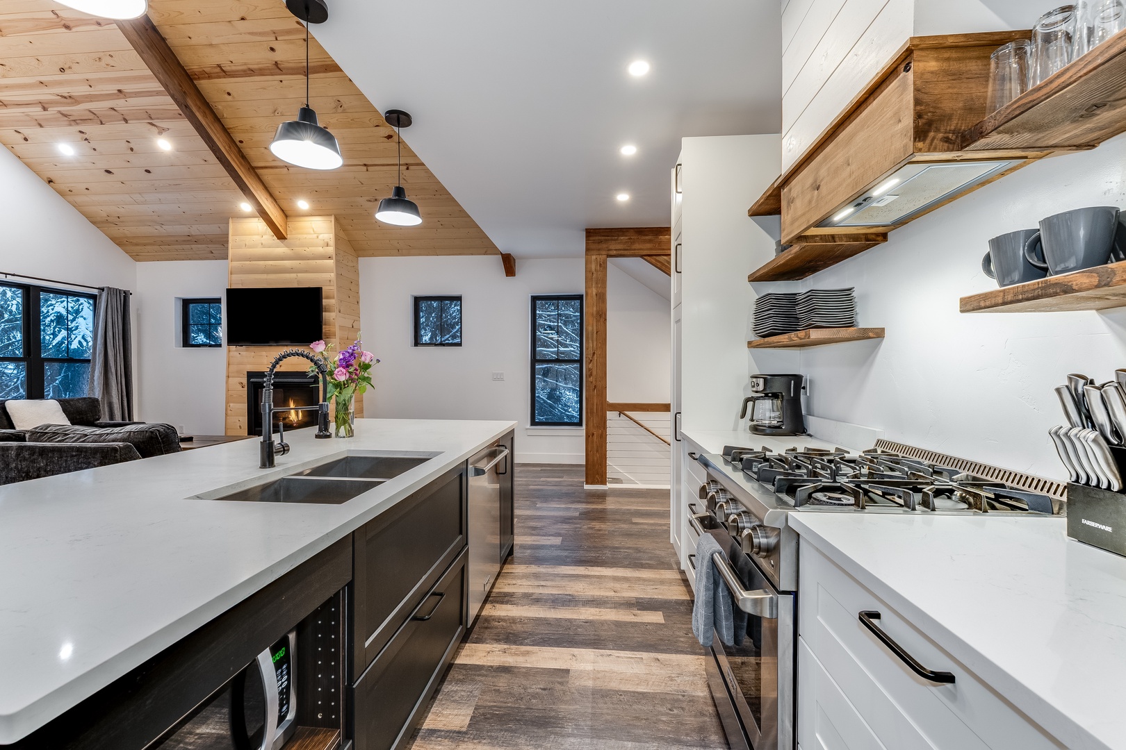 Your gourmet kitchen features rustic wood beams, modern appliances, and sleek countertops—perfect for creating memorable meals together.