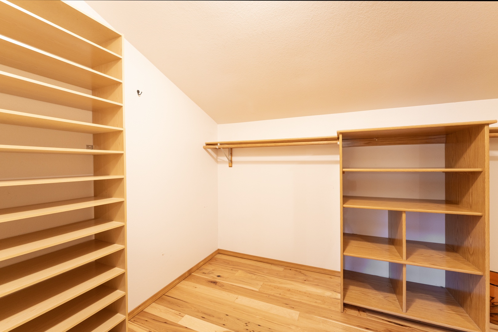 Your spacious walk-in closet offers abundant storage with custom shelving and hanging space for all your belongings.