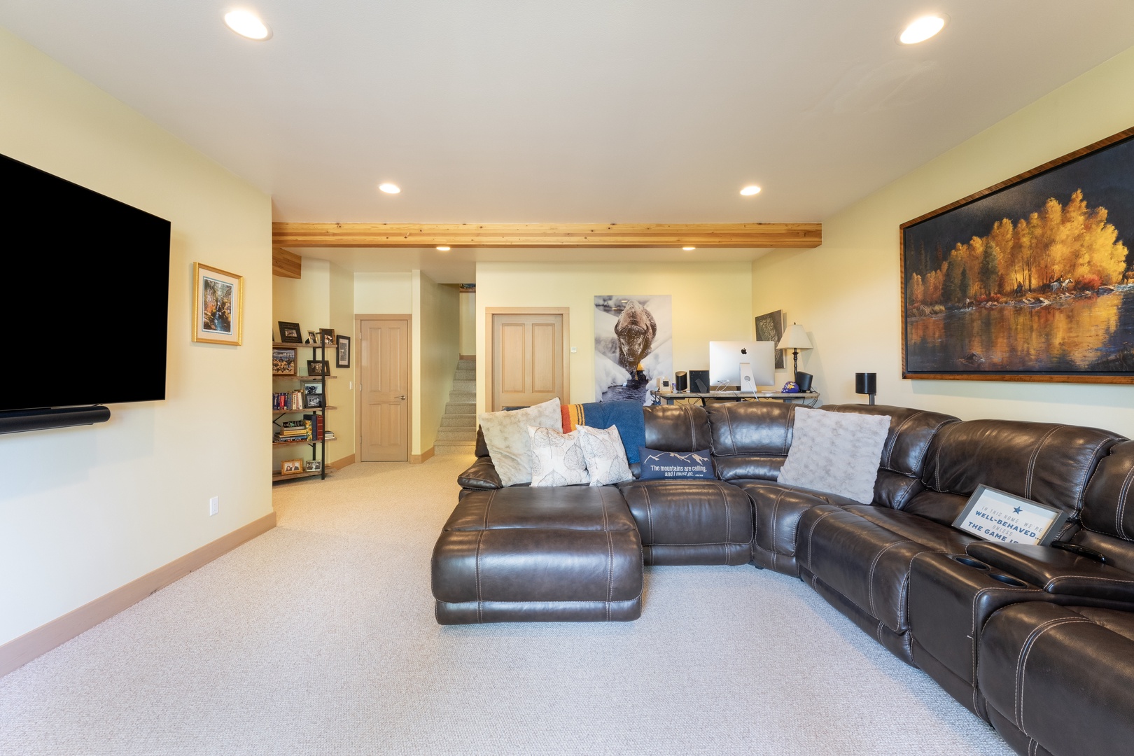 Sink into plush leather seating in your spacious living area, where natural wood accents and warm lighting create the perfect retreat after a day of adventure.