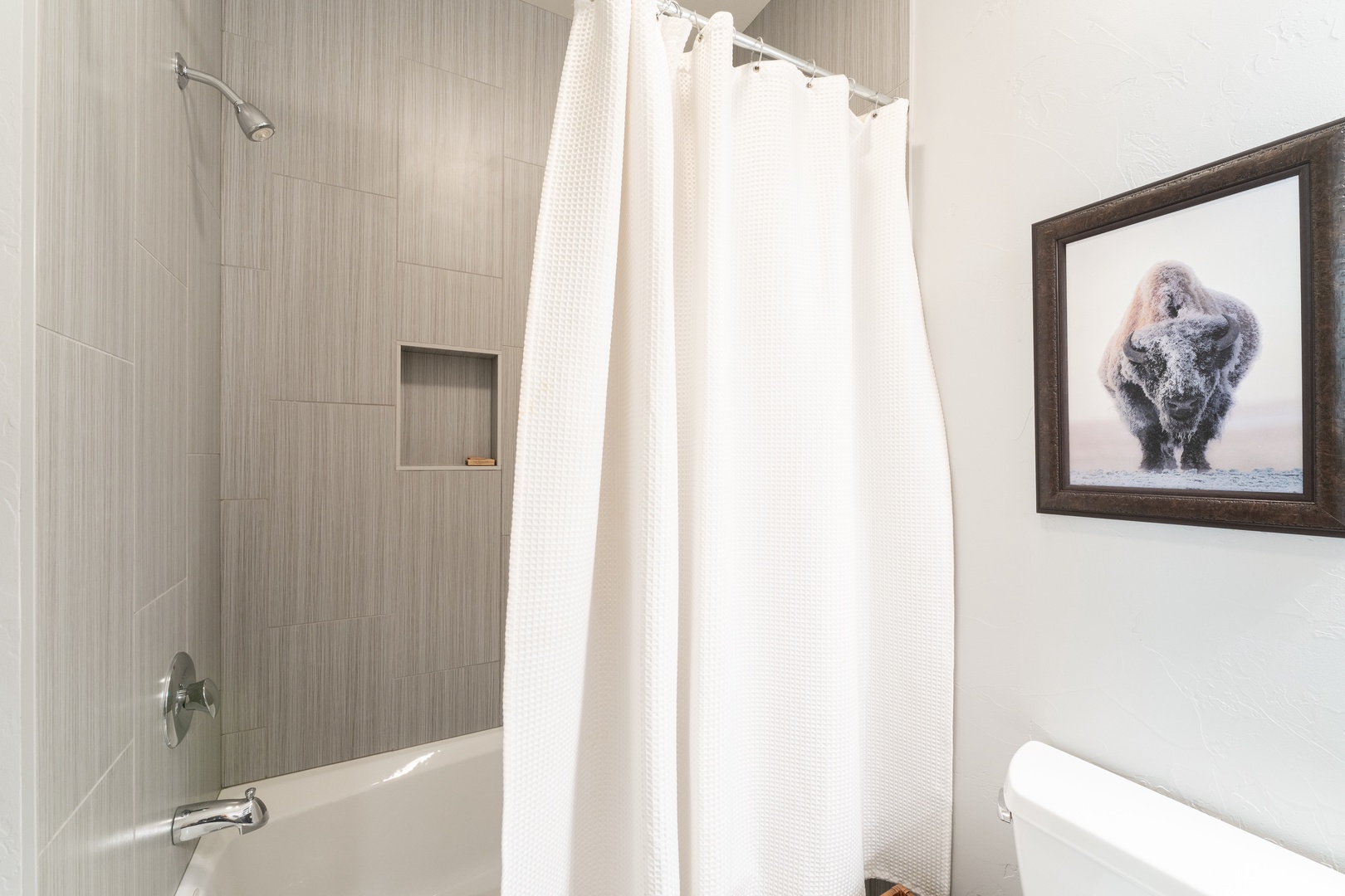 Step into your crisp, clean bathroom with a soaking tub and refreshing shower. Light tones and simple design create a peaceful retreat for your morning or evening routine.