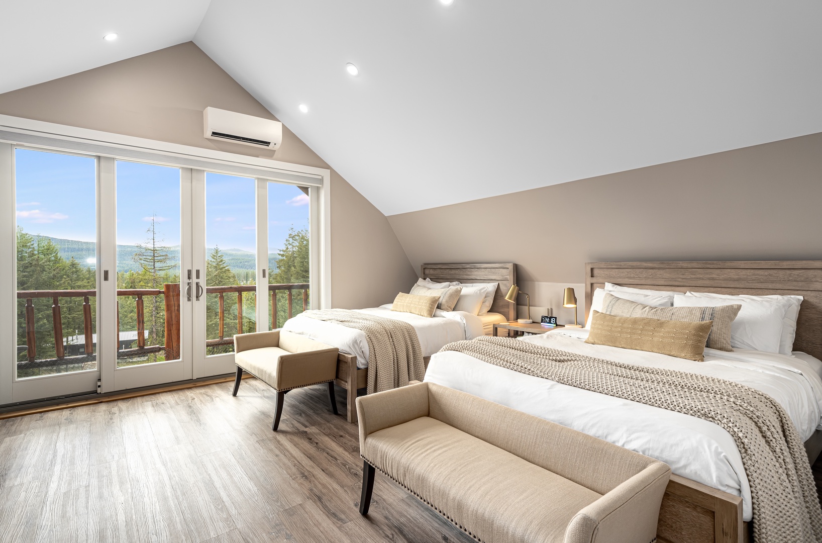 Wake up to stunning mountain views in this bright, airy bedroom with two plush beds and private balcony access. Relax in comfort with climate-controlled air and room to unwind.