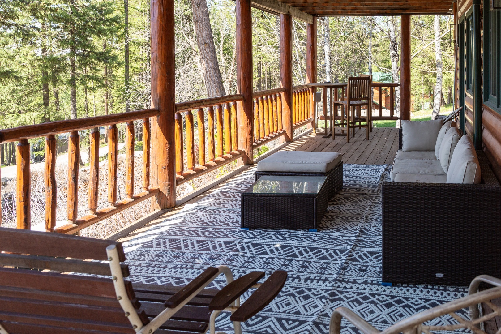 Step onto your private covered porch, where plush seating and forest views invite you to unwind. Sip morning coffee at the bistro table or stretch out on the daybed, surrounded by towering trees and fresh mountain air.