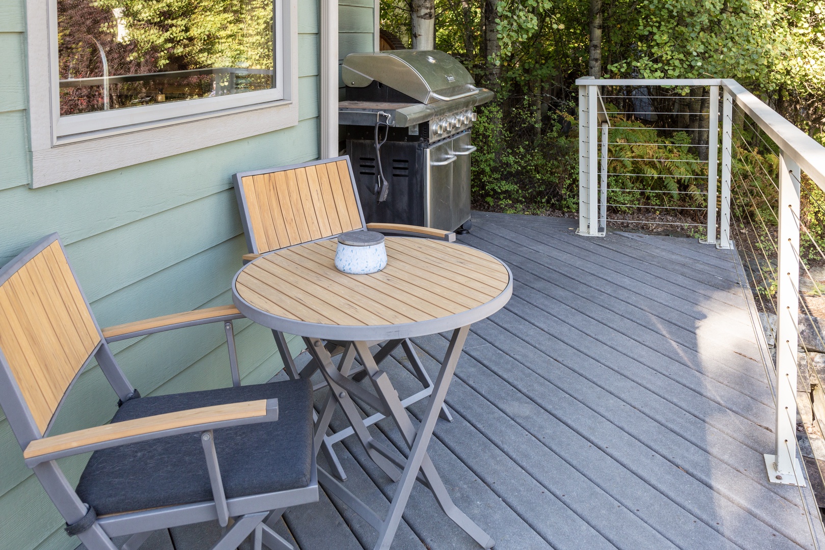 Enjoy your morning coffee or fire up the grill on your private deck, surrounded by lush greenery and plenty of natural light.