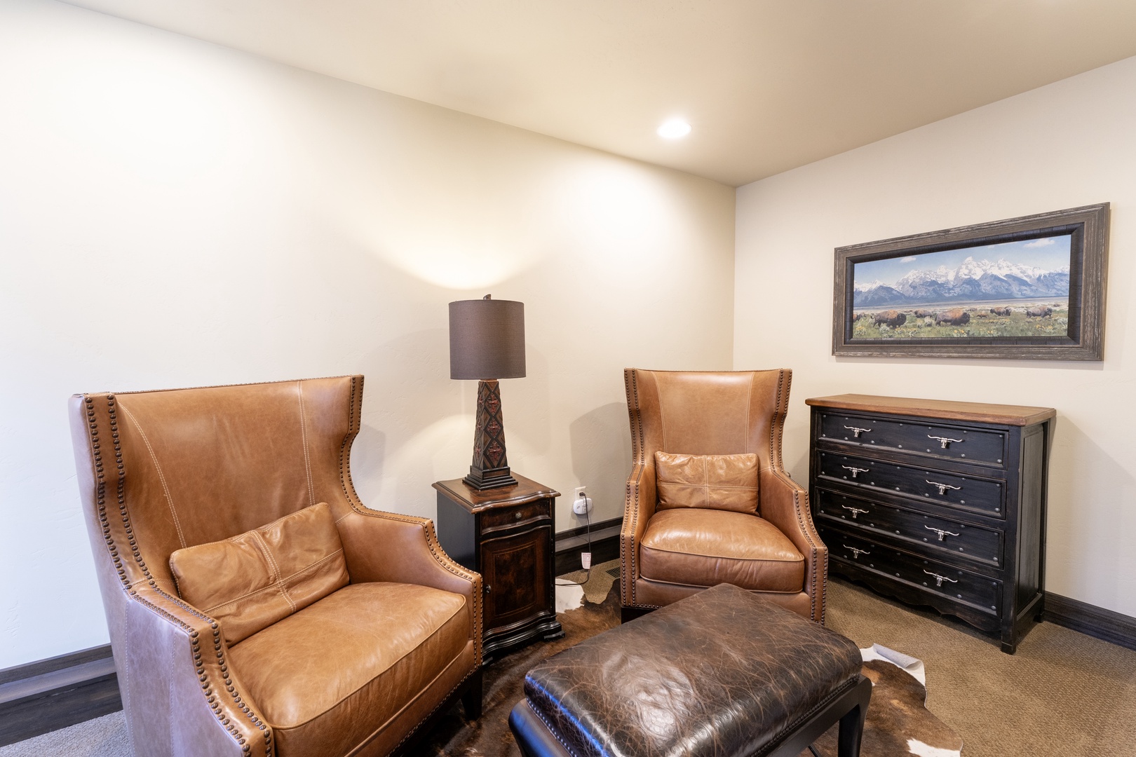 Sink into soft leather chairs and put your feet up in your private retreat, where warm Western touches and thoughtful comfort await.