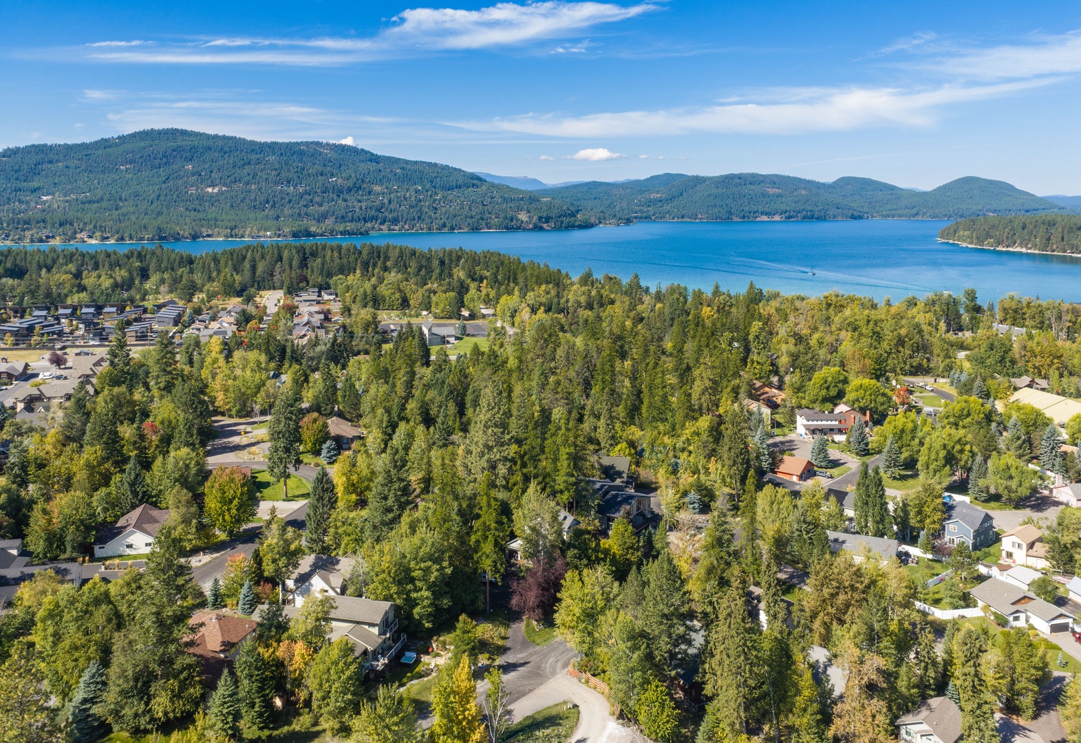 Nestled along the shores of a stunning mountain lake, this peaceful community offers breathtaking natural beauty and serene surroundings in every direction.