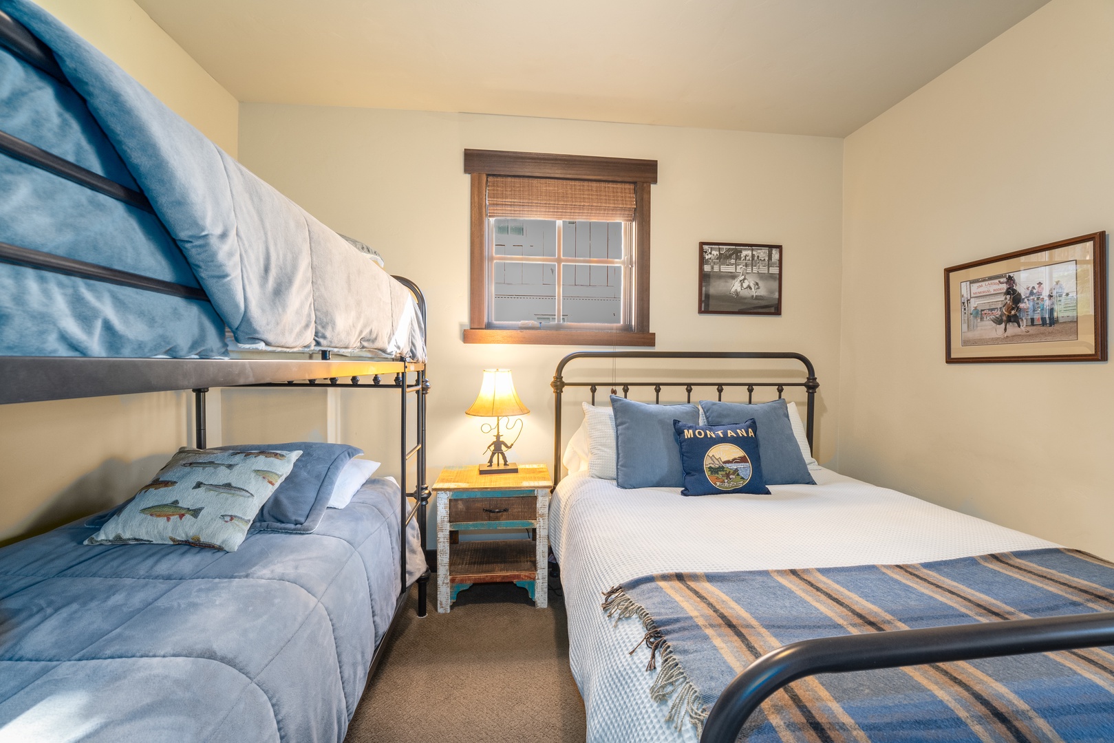 Your cozy retreat features a comfortable full bed and a twin bunk, perfect for families or groups. Warm lighting and mountain-inspired touches create a welcoming space where everyone can rest after a day of adventure.
