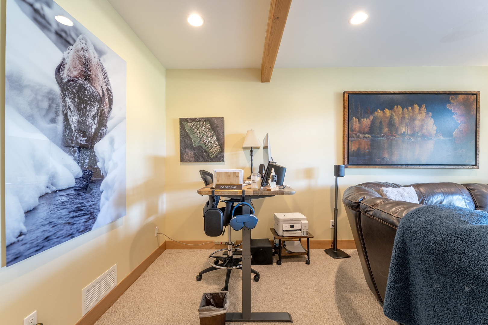 Settle into your private workspace featuring warm wood accents, recessed lighting, and a comfortable leather sofa—perfect for productive days or quiet evenings in.