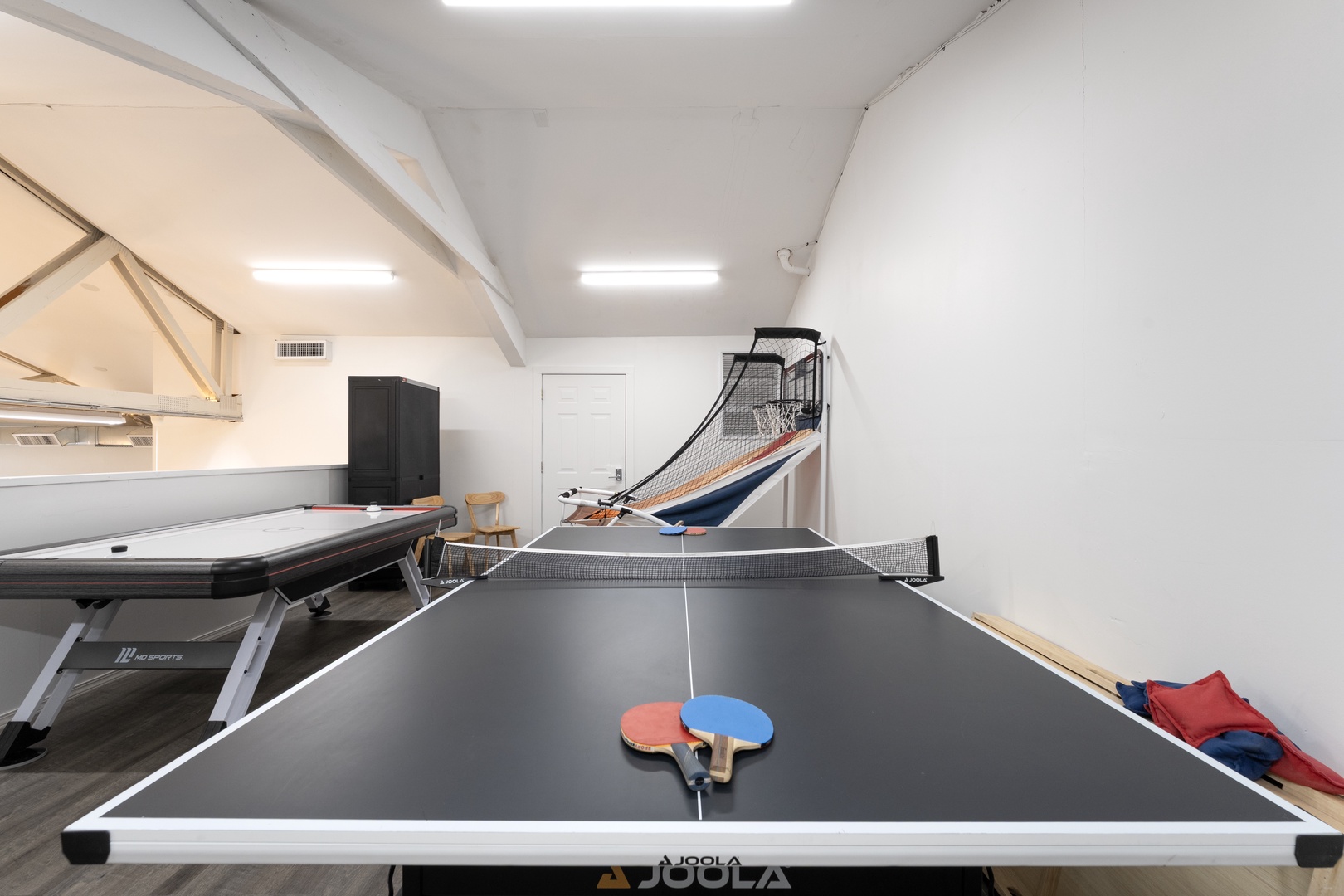 Challenge your friends to ping pong, basketball, or billiards in this spacious game room—your personal entertainment hub for friendly competition and fun.