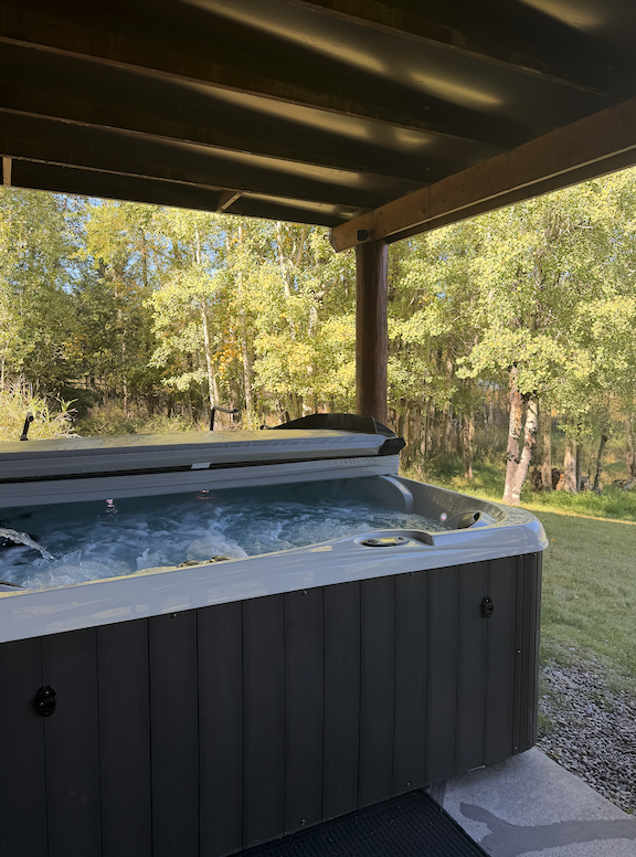 Enjoy your private hot tub overlooking Skyles Lake and the fire pit