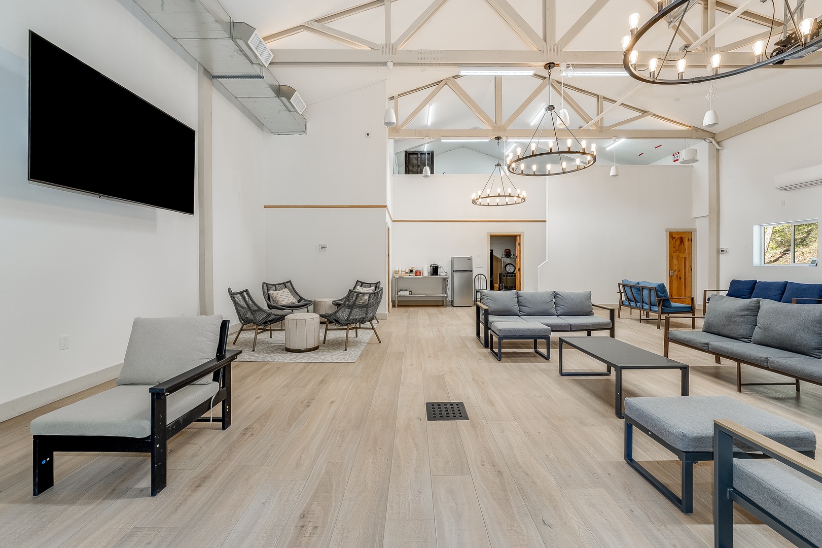 Gather with family and friends in this airy communal lounge, where vaulted ceilings, modern seating, and inviting decor create the perfect space to relax and connect together.