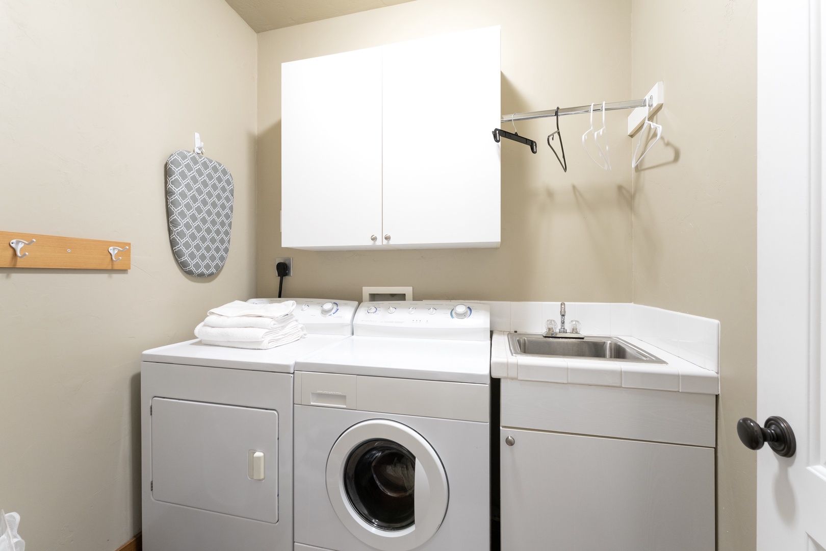 A dedicated laundry room keeps your vacation hassle-free with a full-size washer and dryer, plus a utility sink for extra convenience.