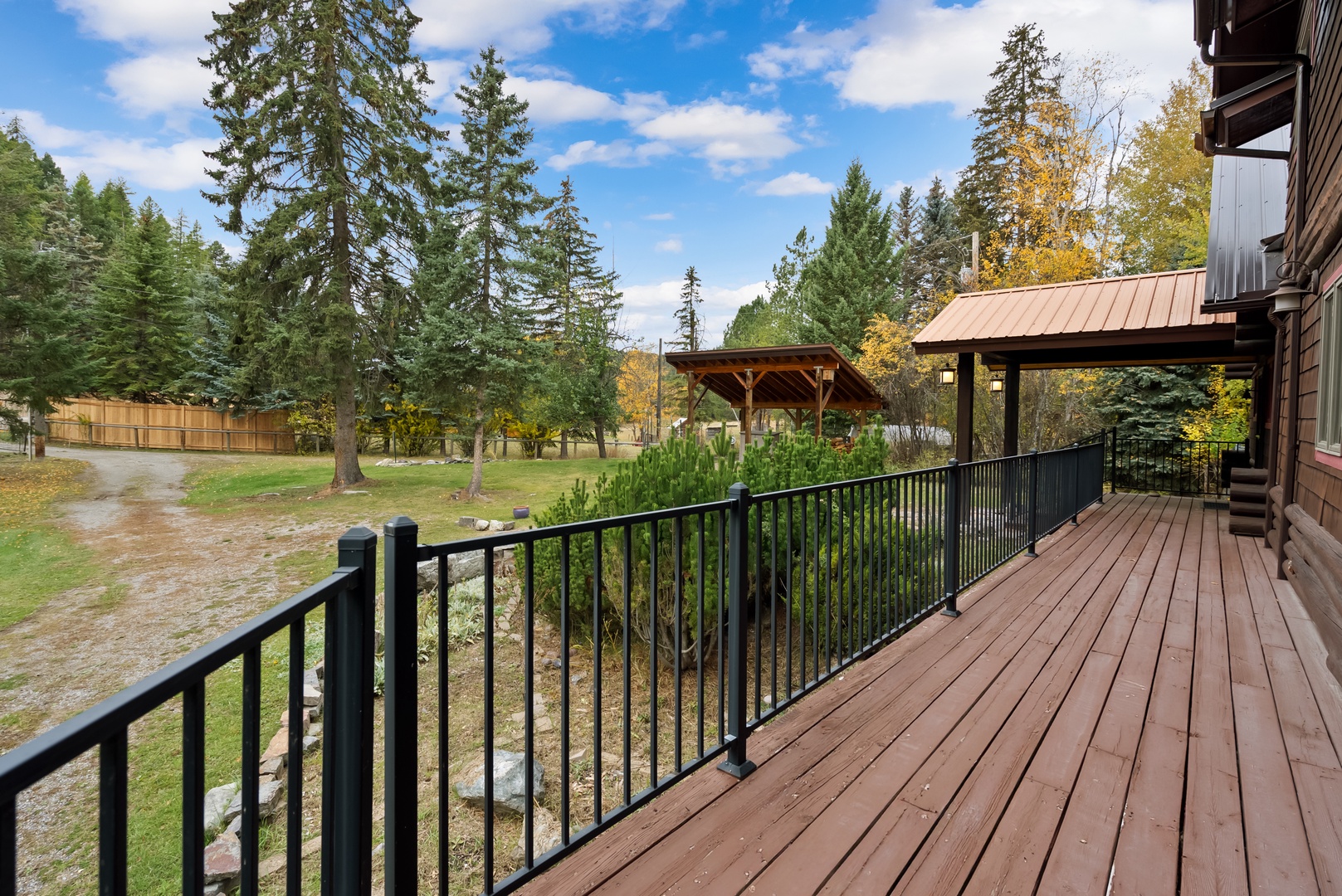 Spacious wooden deck with forest views and mountain air for your perfect retreat.