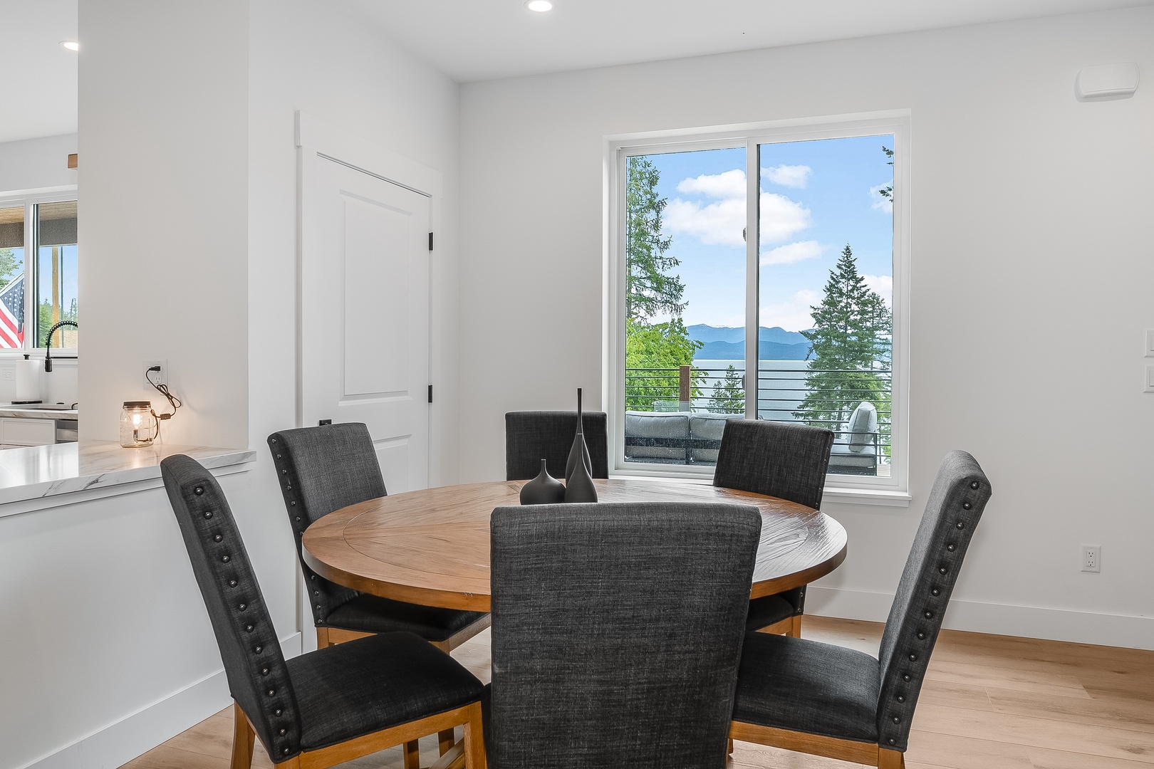 Gather around the table and savor meals with stunning lake and mountain views framing every moment. The natural light and peaceful scenery create the perfect backdrop for your getaway dining experiences.