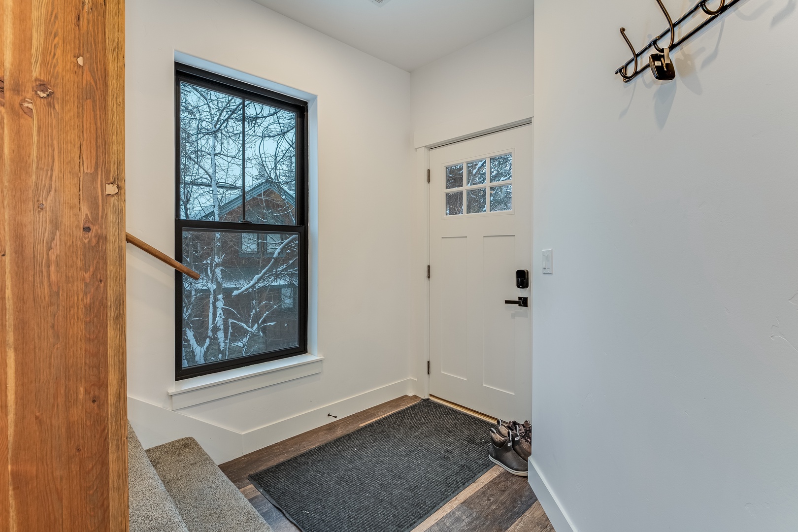Step into your welcoming entryway with built-in bench, perfect for settling in after exploring the snowy neighborhood outside.