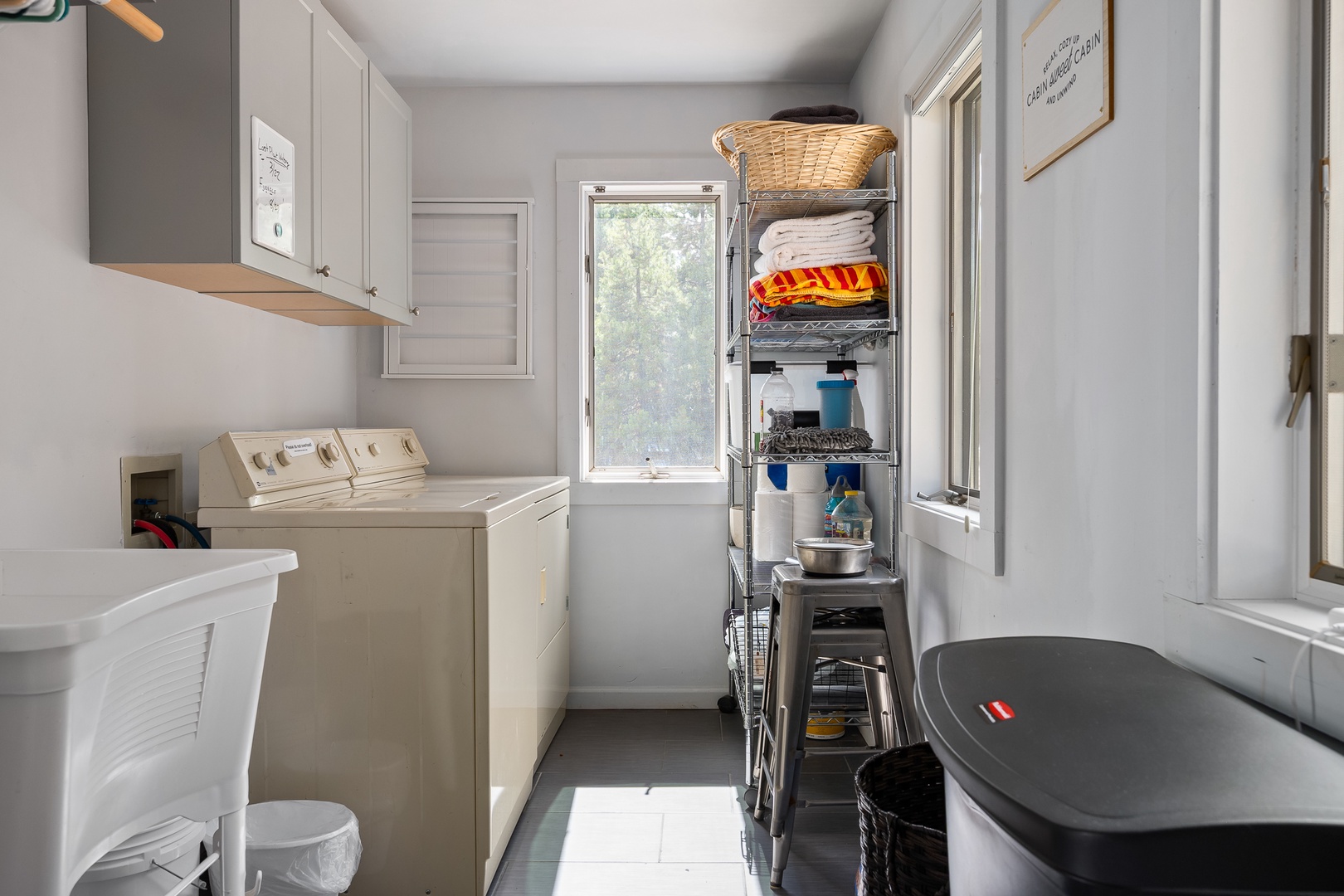A bright, well-organized laundry space keeps your vacation essentials fresh and ready, with plenty of storage to help you feel right at home.