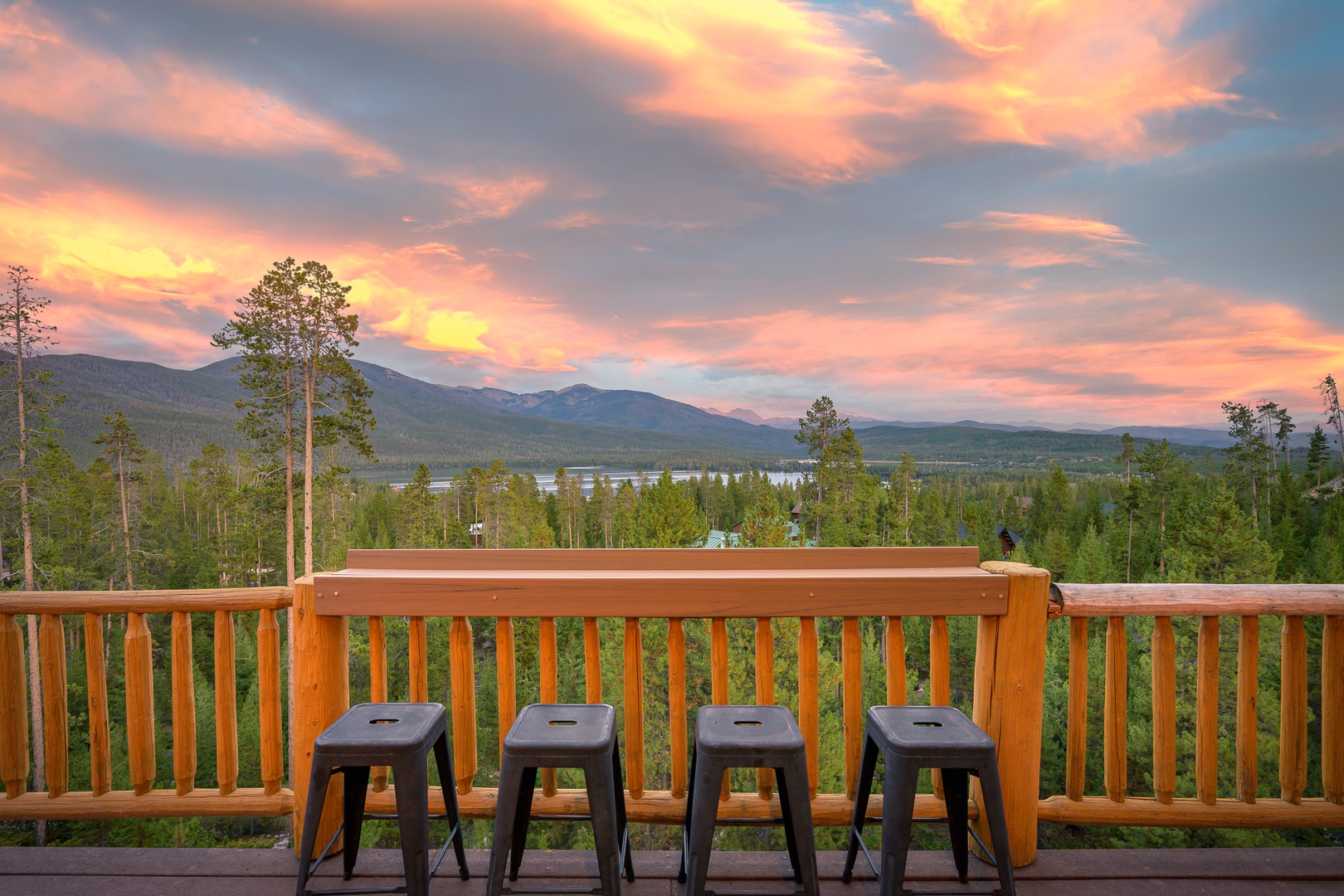 Stunning mountain and lake views frame the deck where colorful sunsets become your evening backdrop. Pull up a stool and soak in the serenity.