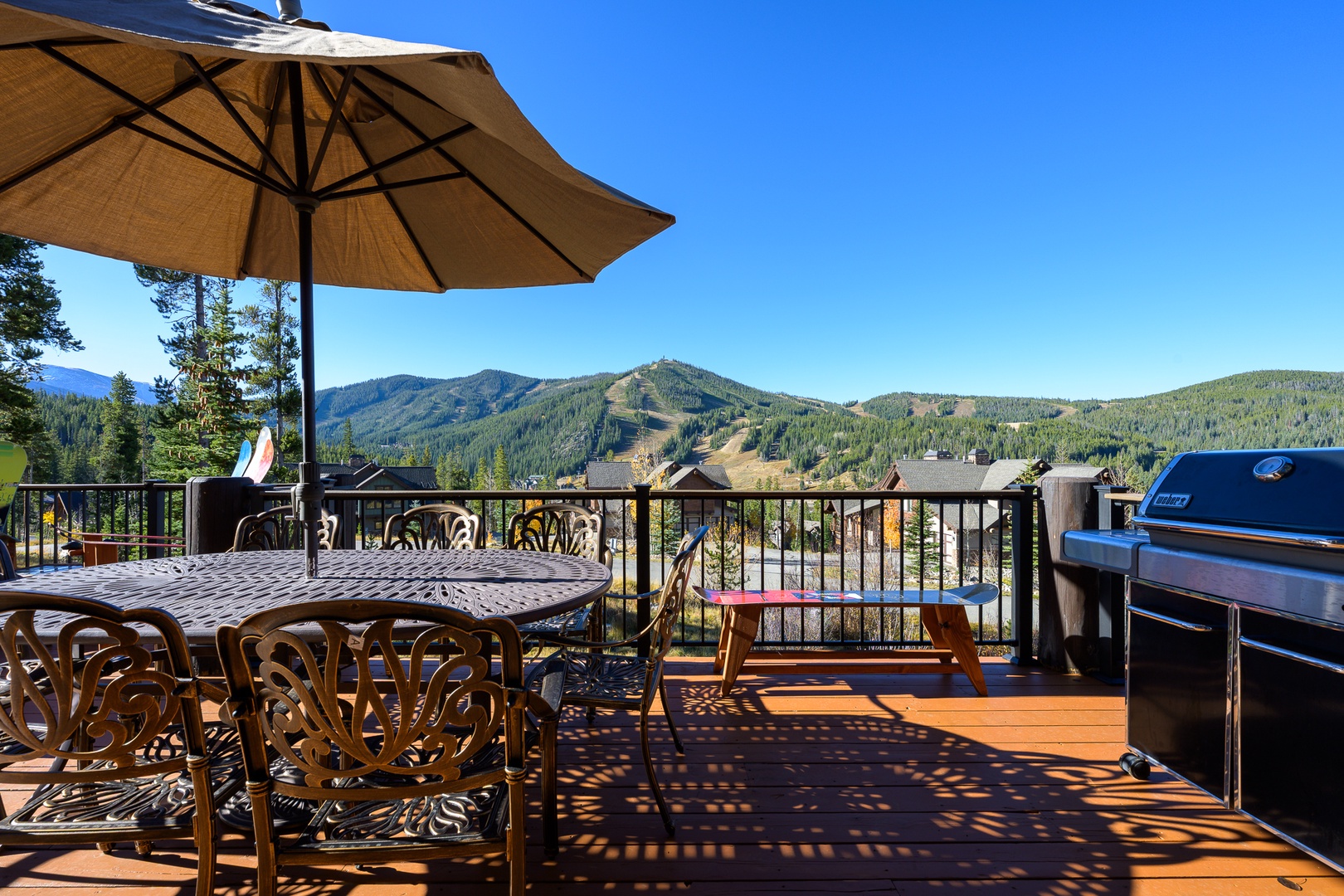 Your private deck offers stunning mountain views, shaded dining, and a premium BBQ for unforgettable outdoor meals.