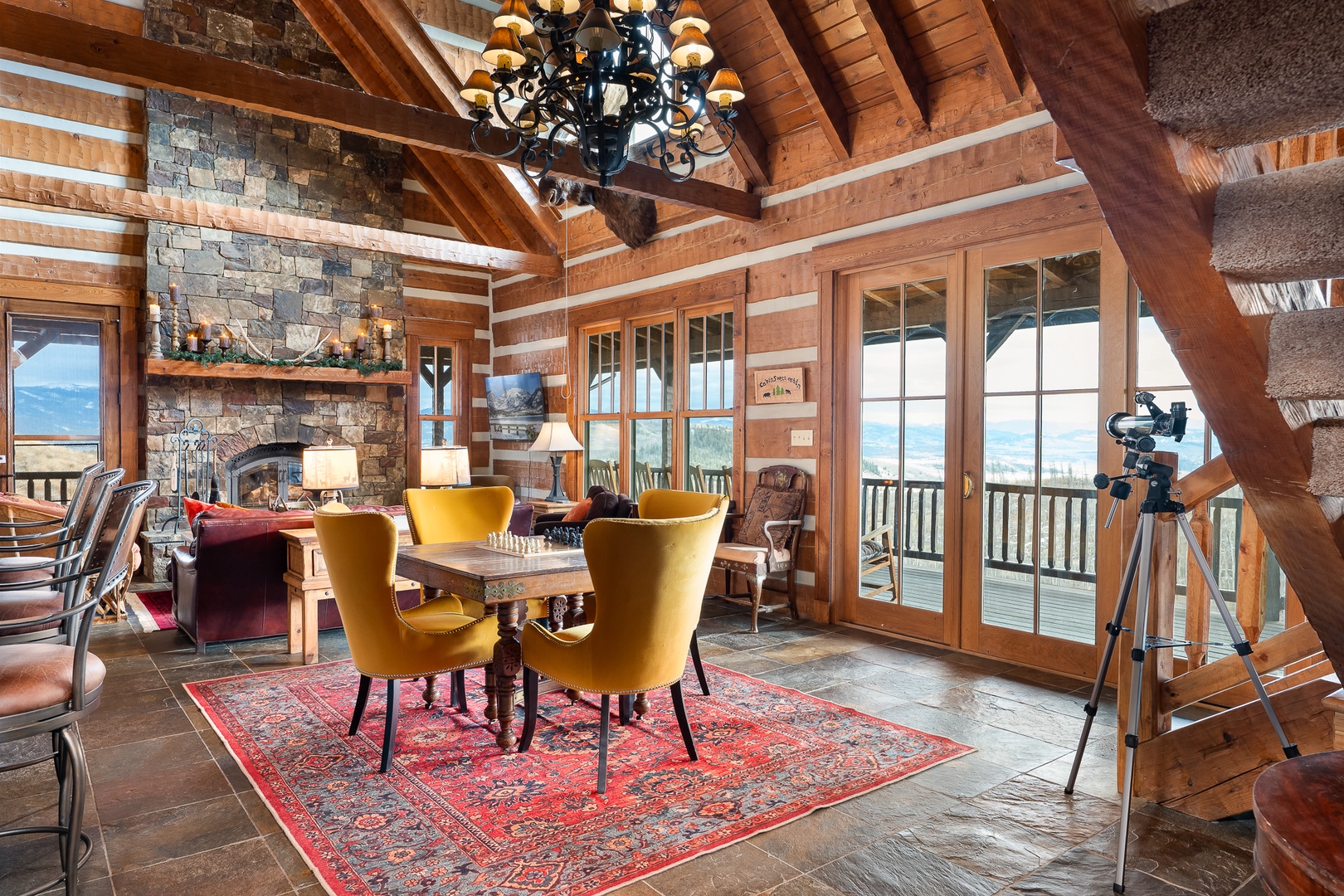 Gather around this elegant dining table  with mountain views framing your memorable meals.