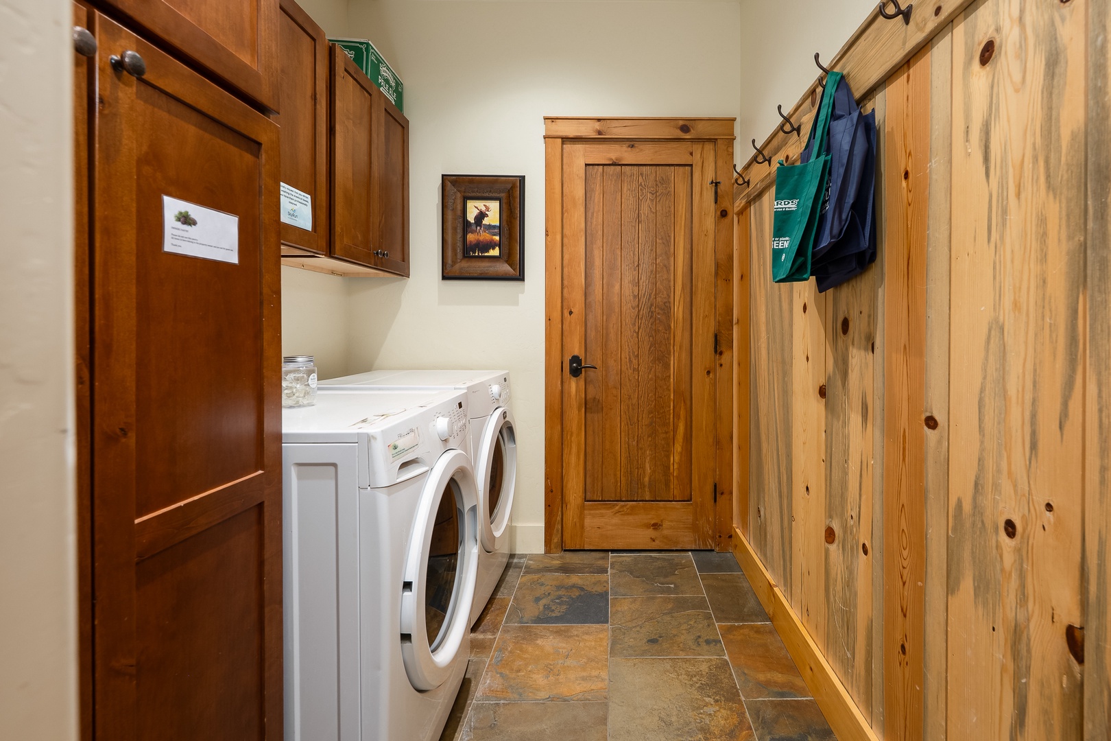 Your private laundry room features a full-size washer and dryer, plus convenient storage hooks—perfect for keeping gear organized during your stay.