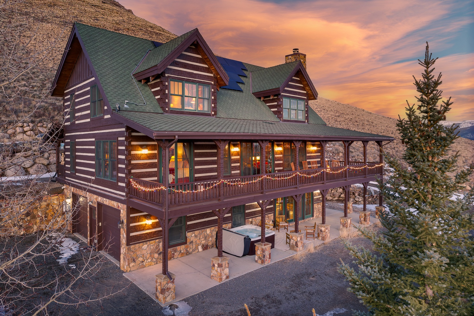 A stunning mountain cabin retreat with wrap-around decks and cozy lighting.