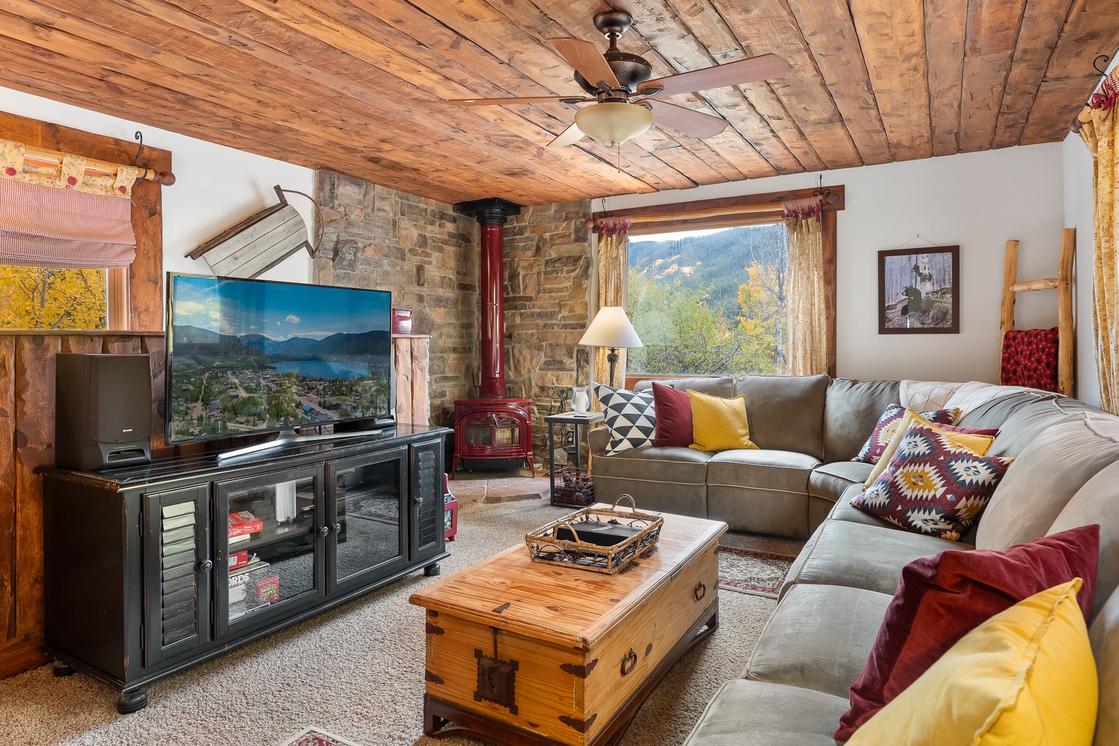 Unwind in your cozy mountain retreat with stunning views, rustic wood ceilings, and a warming fireplace—perfect for relaxation after a day of adventure.