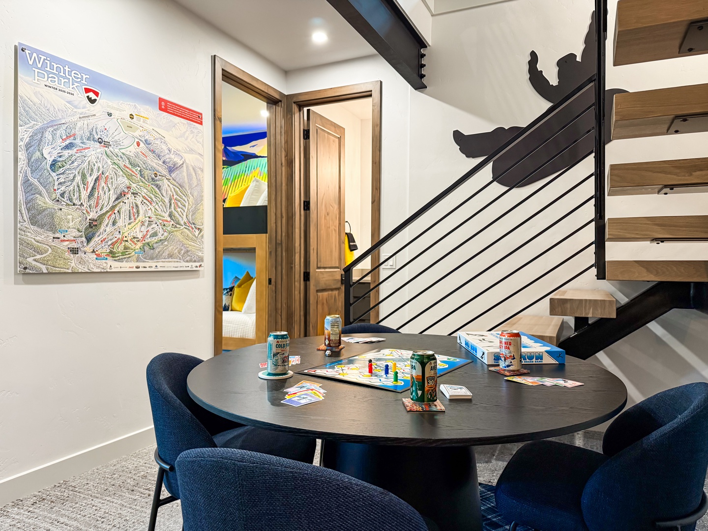 There’s a dining table perfect for snacks and games next to a mini fridge and wet bar downstairs.