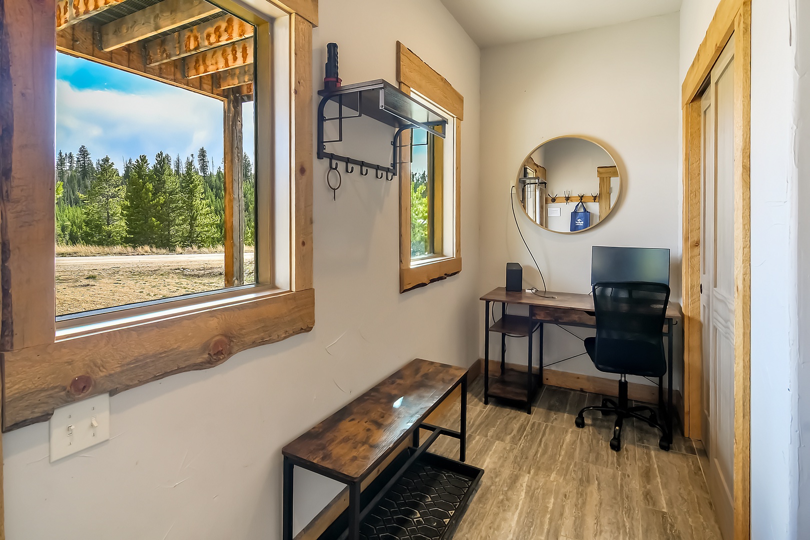 Your bright workspace opens to stunning forest views, perfect for productive mornings with nature as your backdrop.