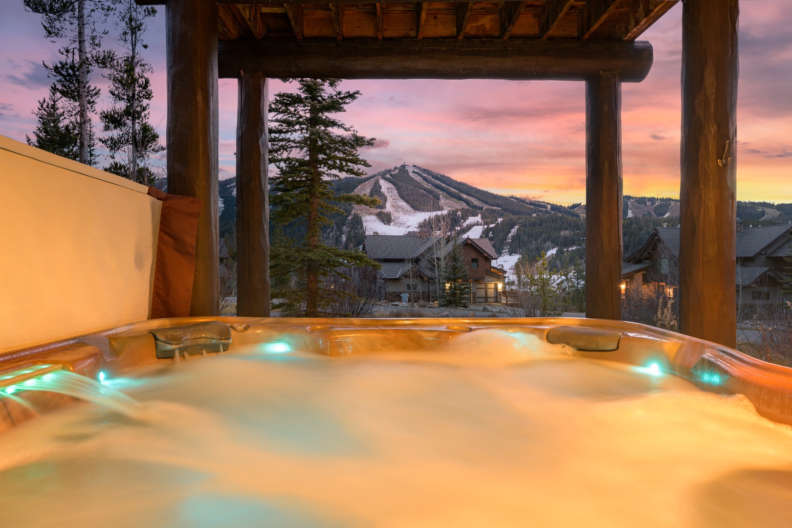 Soak in your private hot tub while watching the sunset paint the sky over snow-capped mountains—pure mountain bliss awaits.