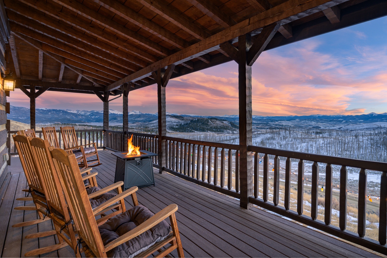 Sunset paints the sky while you rock by the fire on your private deck, surrounded by snow-capped mountain vistas