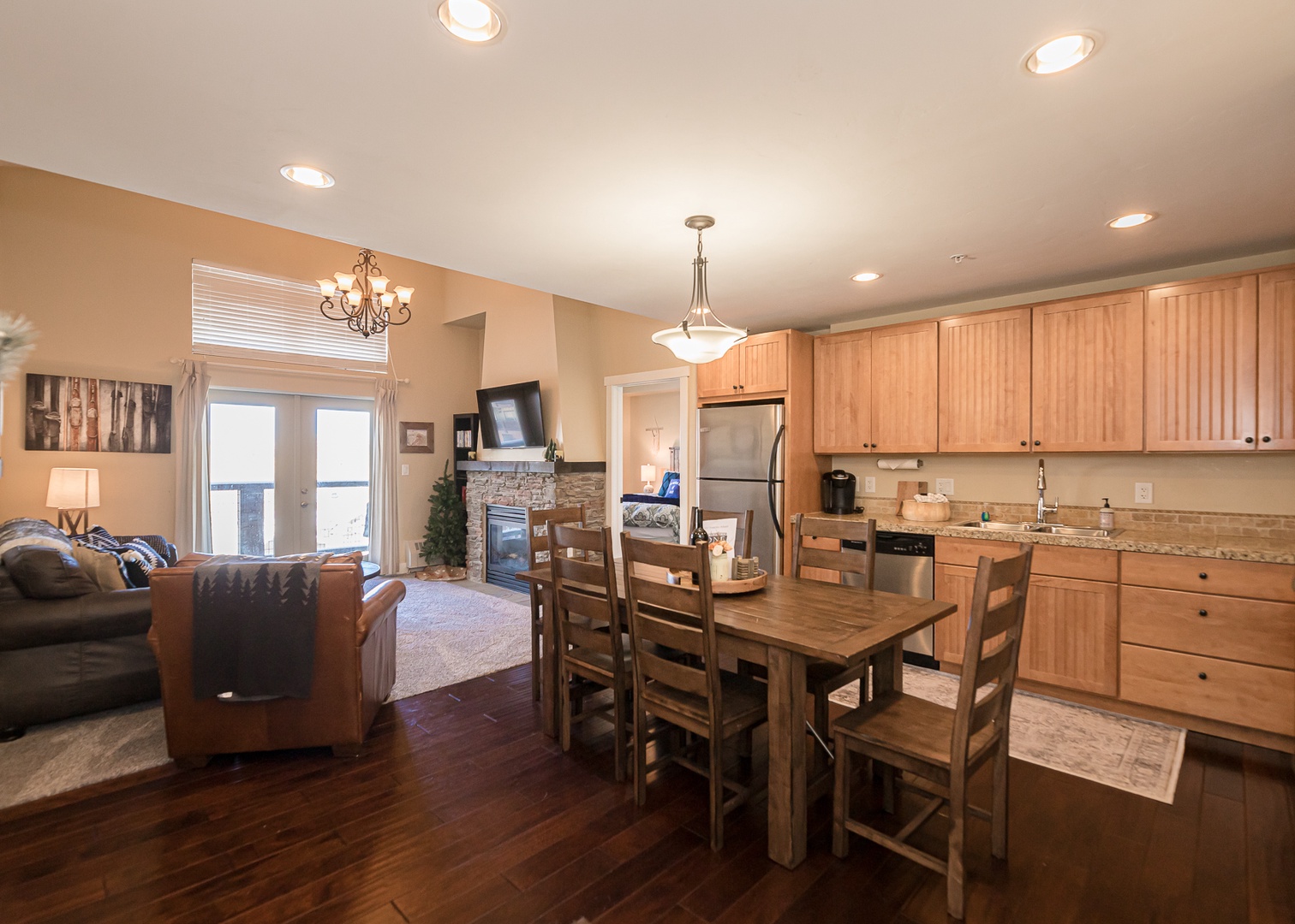 Relax in your open-concept space where kitchen, dining, and living flow seamlessly together, perfect for memorable meals and cozy evenings.