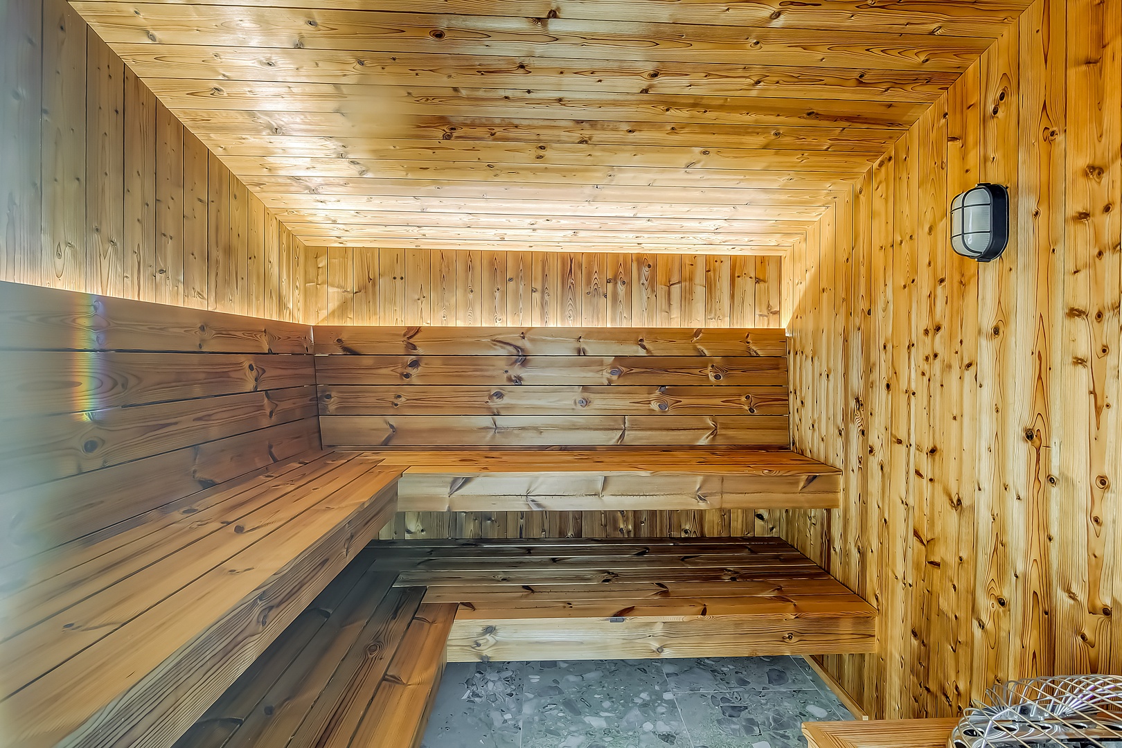 Step into your private sauna sanctuary, where warm cedar wood envelops you in rustic luxury and peaceful relaxation awaits.